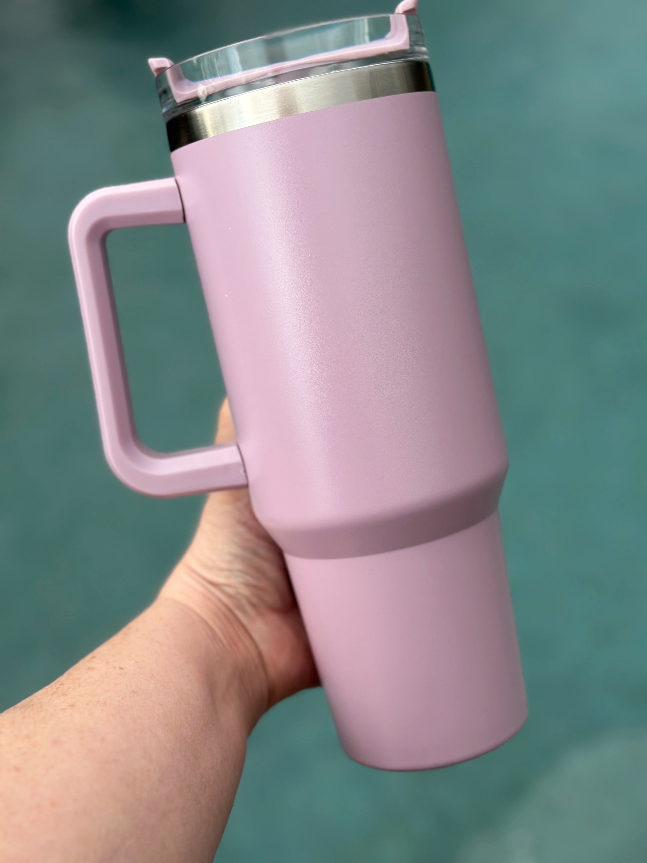 40 oz double walled insulated tumbler in various colors with a screw top lid and straw, perfect for customization.
