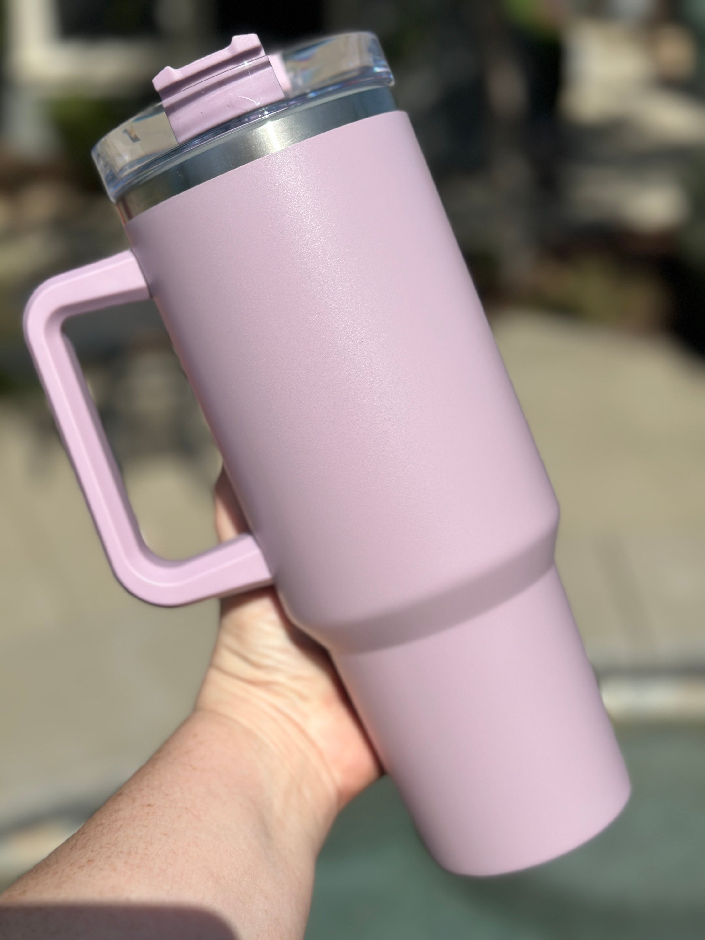 40 oz double walled insulated tumbler in various colors with a screw top lid and straw, perfect for customization.