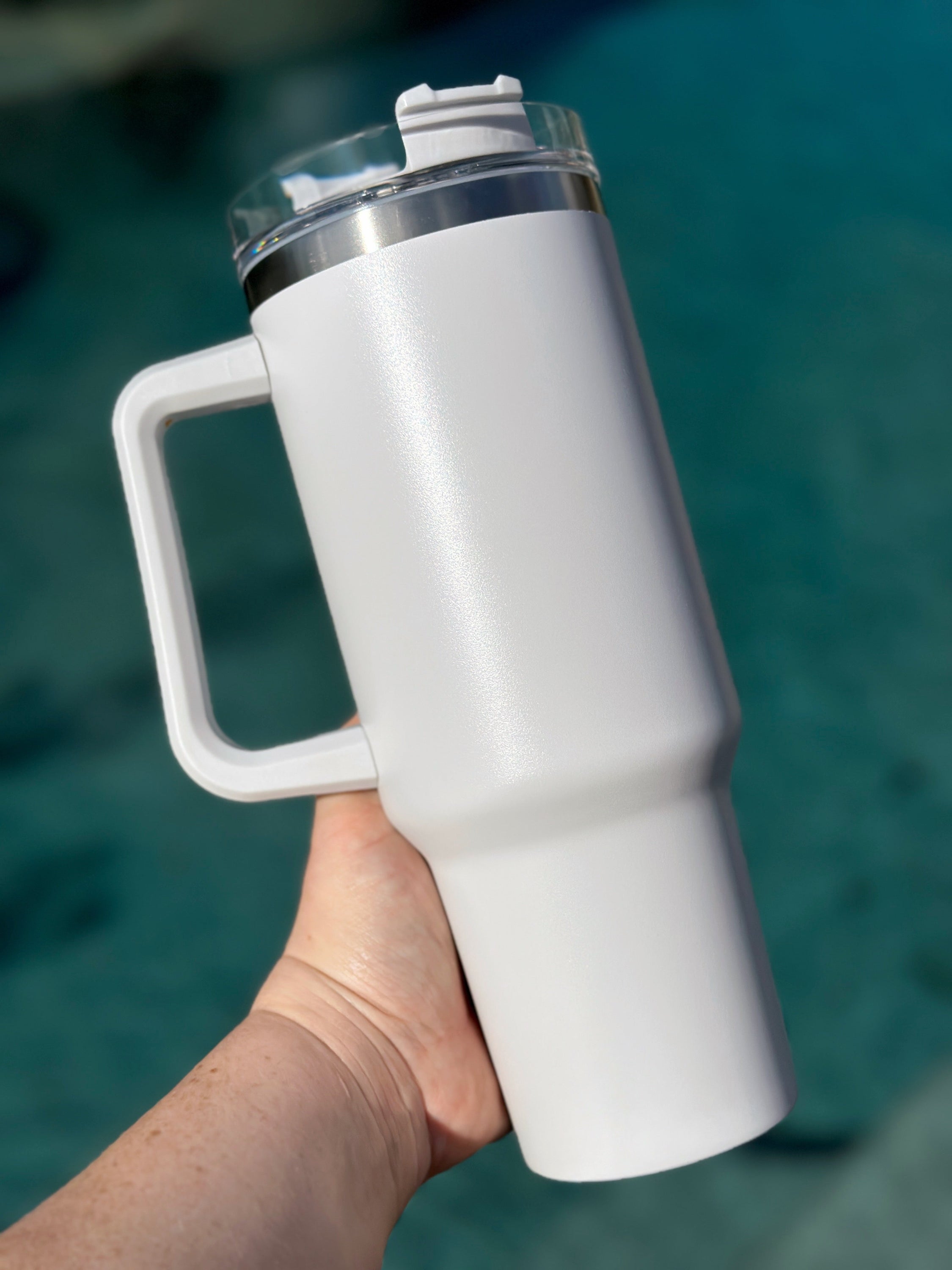 40 oz double walled insulated tumbler in various colors with a screw top lid and straw, perfect for customization.