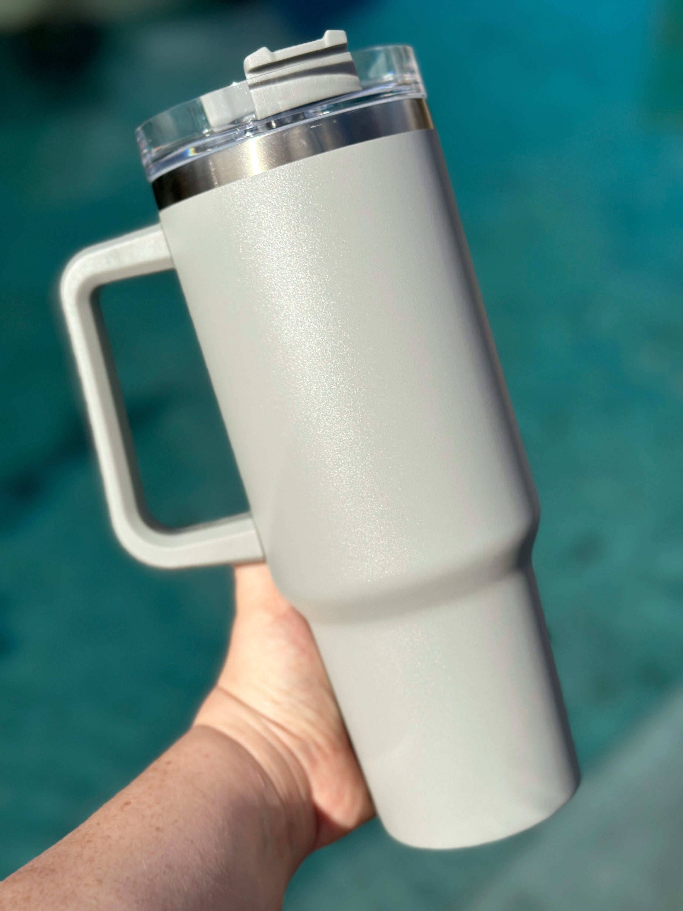 40 oz double walled insulated tumbler in various colors with a screw top lid and straw, perfect for customization.