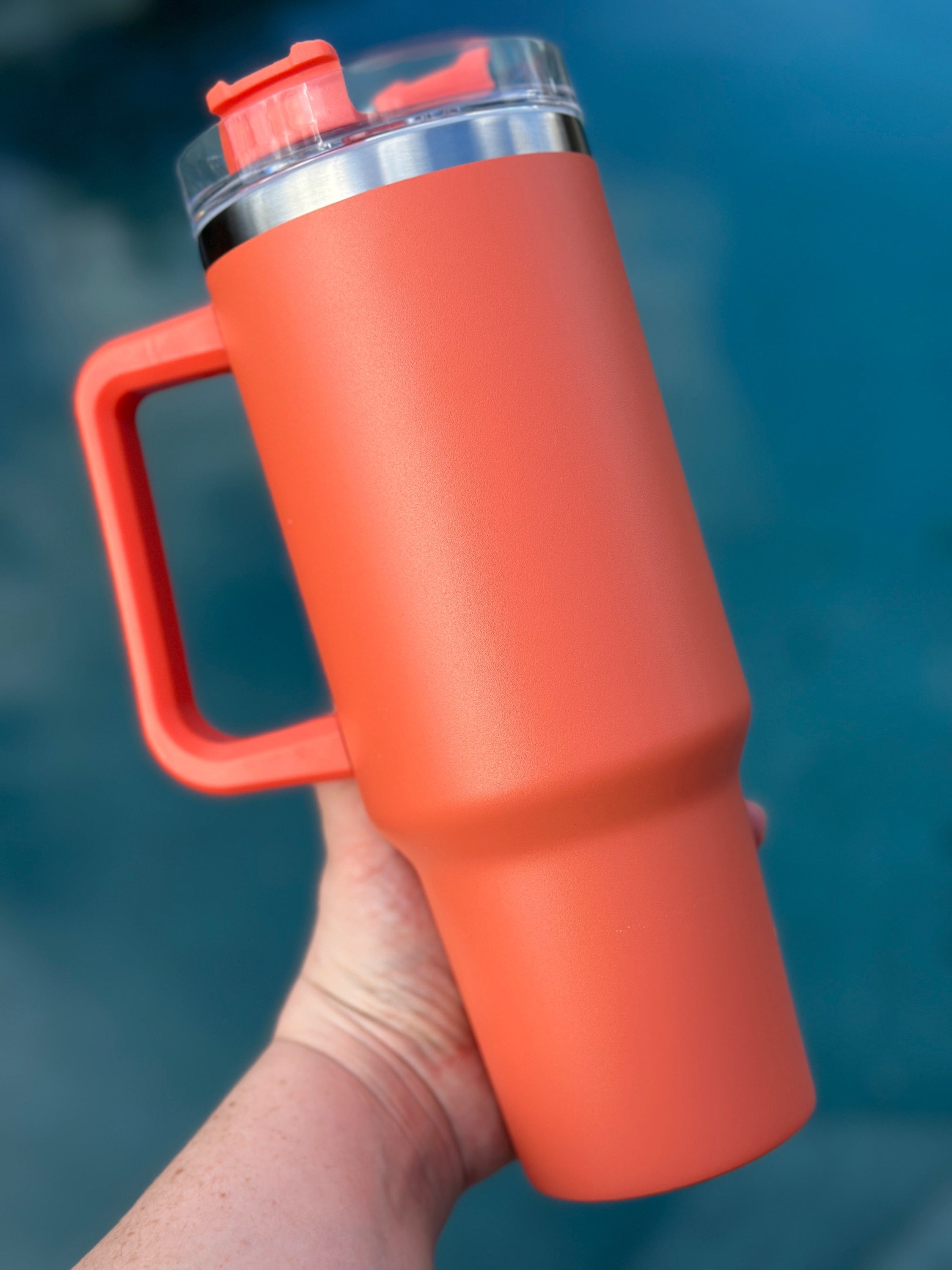 40 oz double walled insulated tumbler in various colors with a screw top lid and straw, perfect for customization.