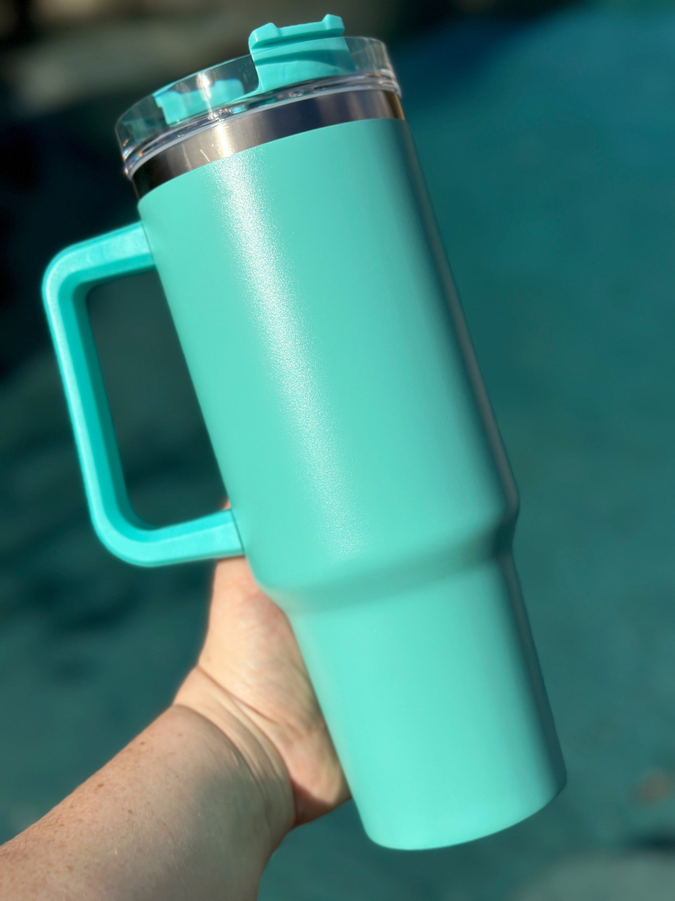 40 oz double walled insulated tumbler in various colors with a screw top lid and straw, perfect for customization.