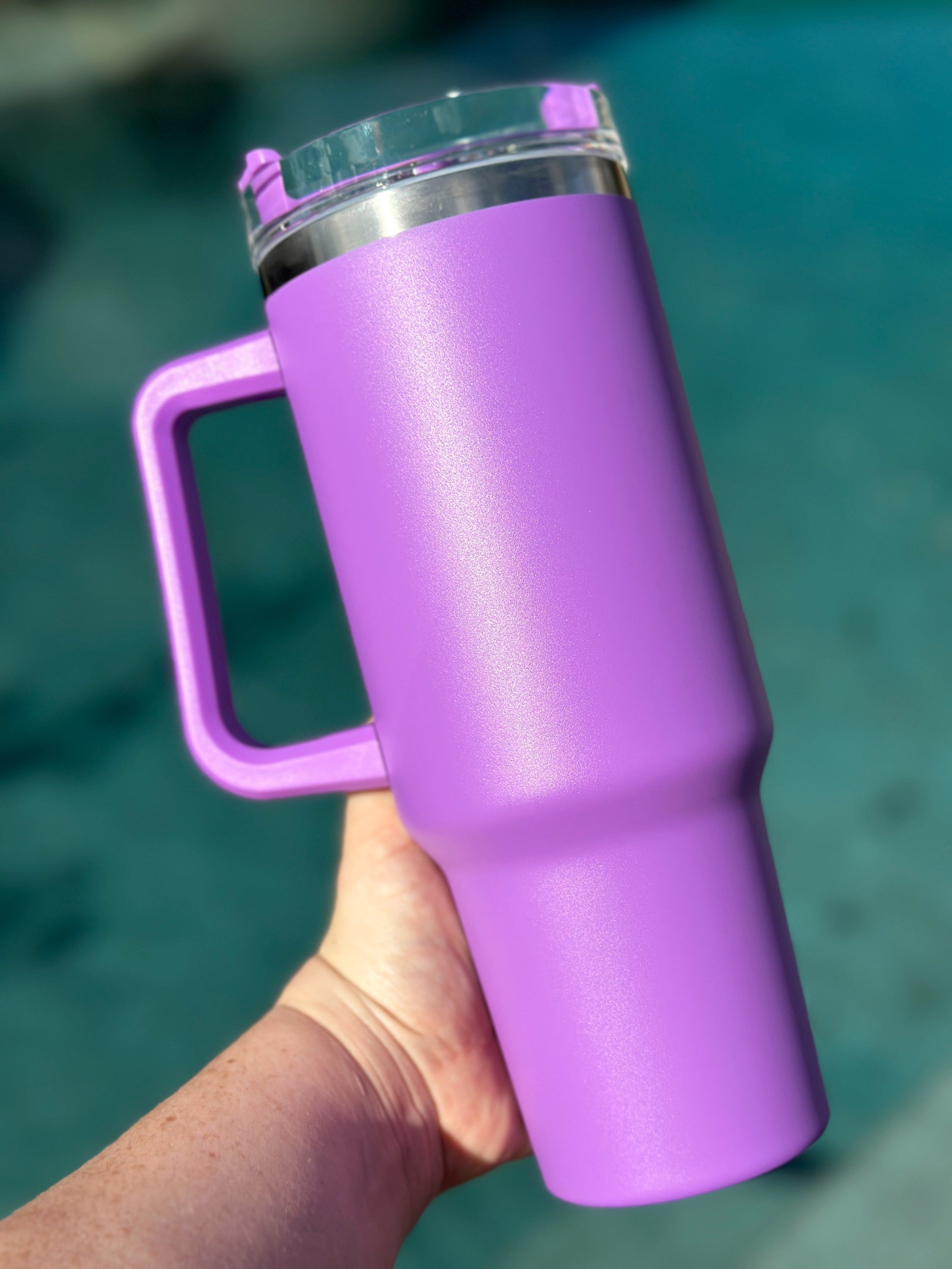 40 oz double walled insulated tumbler in various colors with a screw top lid and straw, perfect for customization.