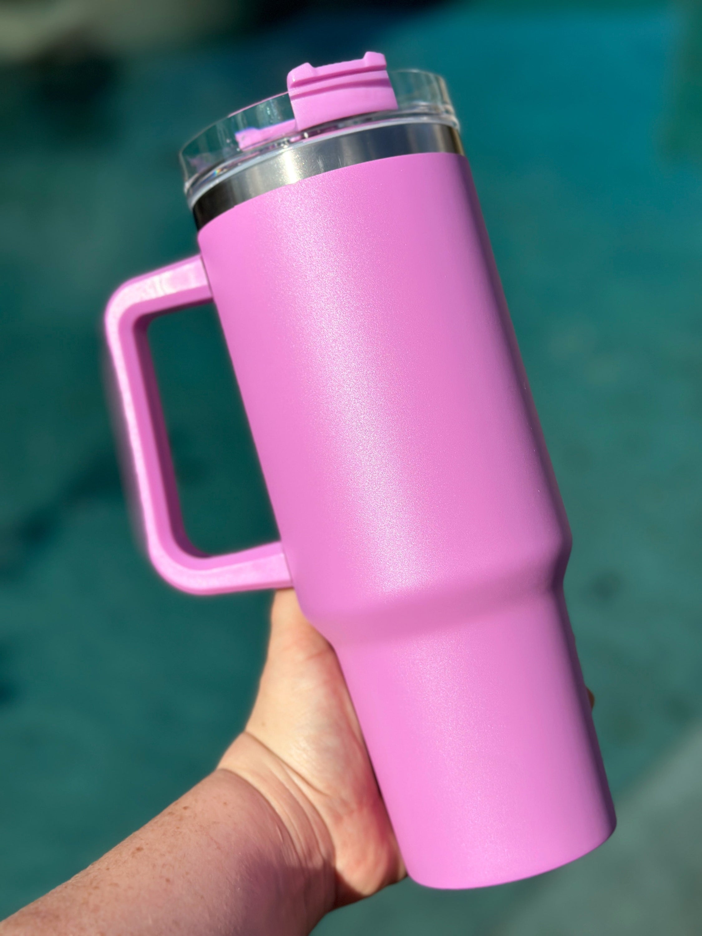 40 oz double walled insulated tumbler in various colors with a screw top lid and straw, perfect for customization.