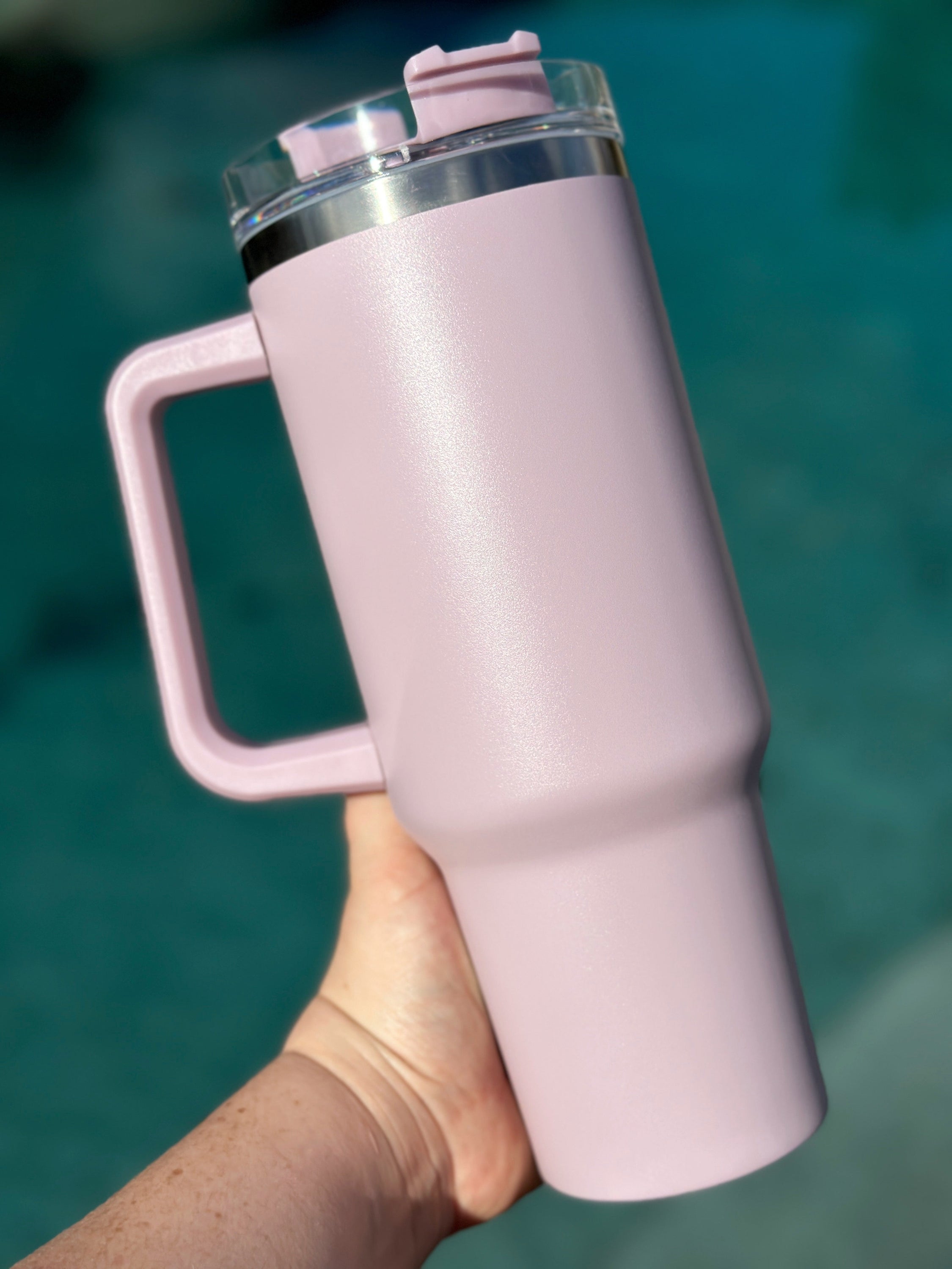 40 oz double walled insulated tumbler in various colors with a screw top lid and straw, perfect for customization.
