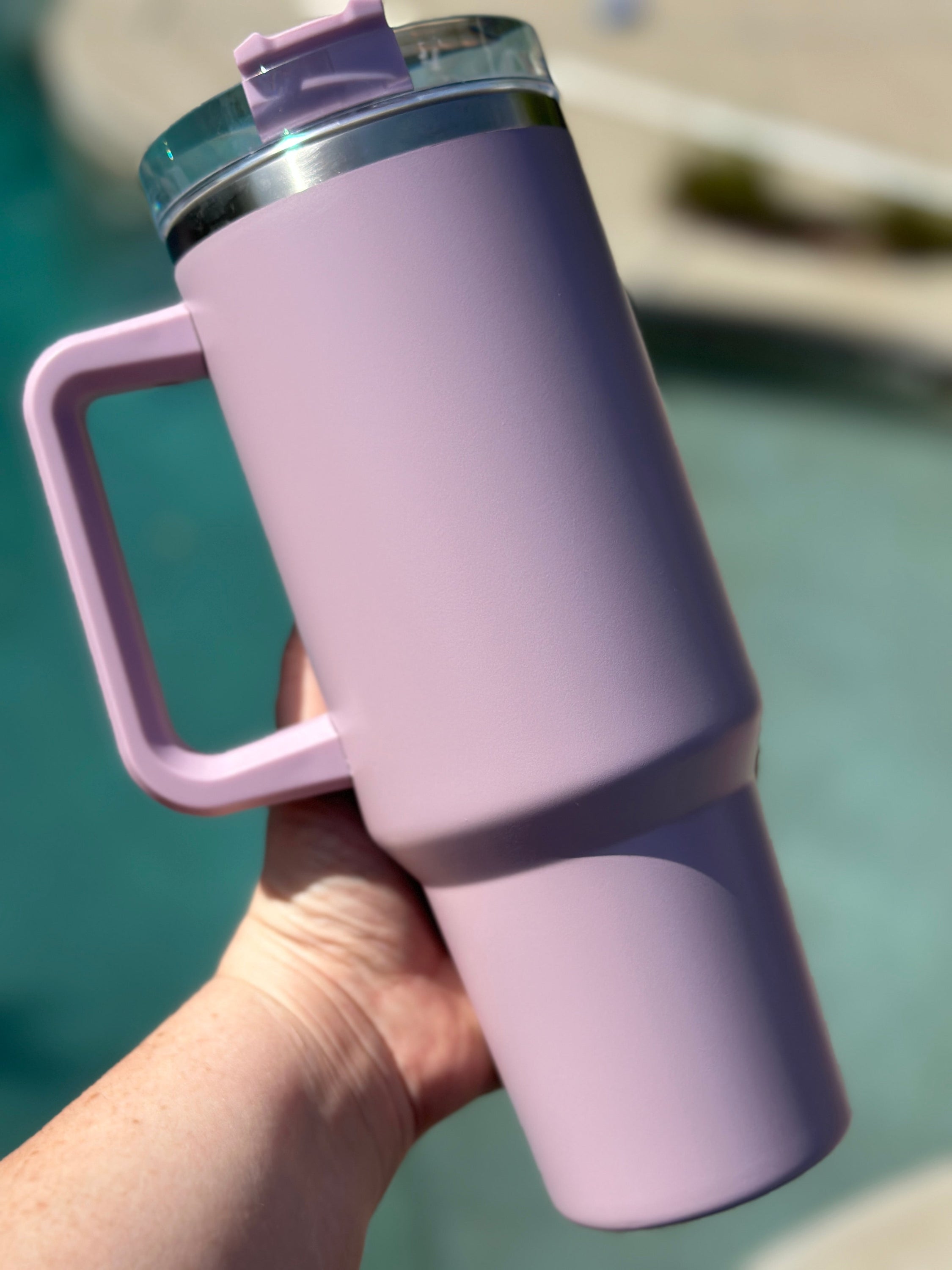 40 oz double walled insulated tumbler in various colors with a screw top lid and straw, perfect for customization.