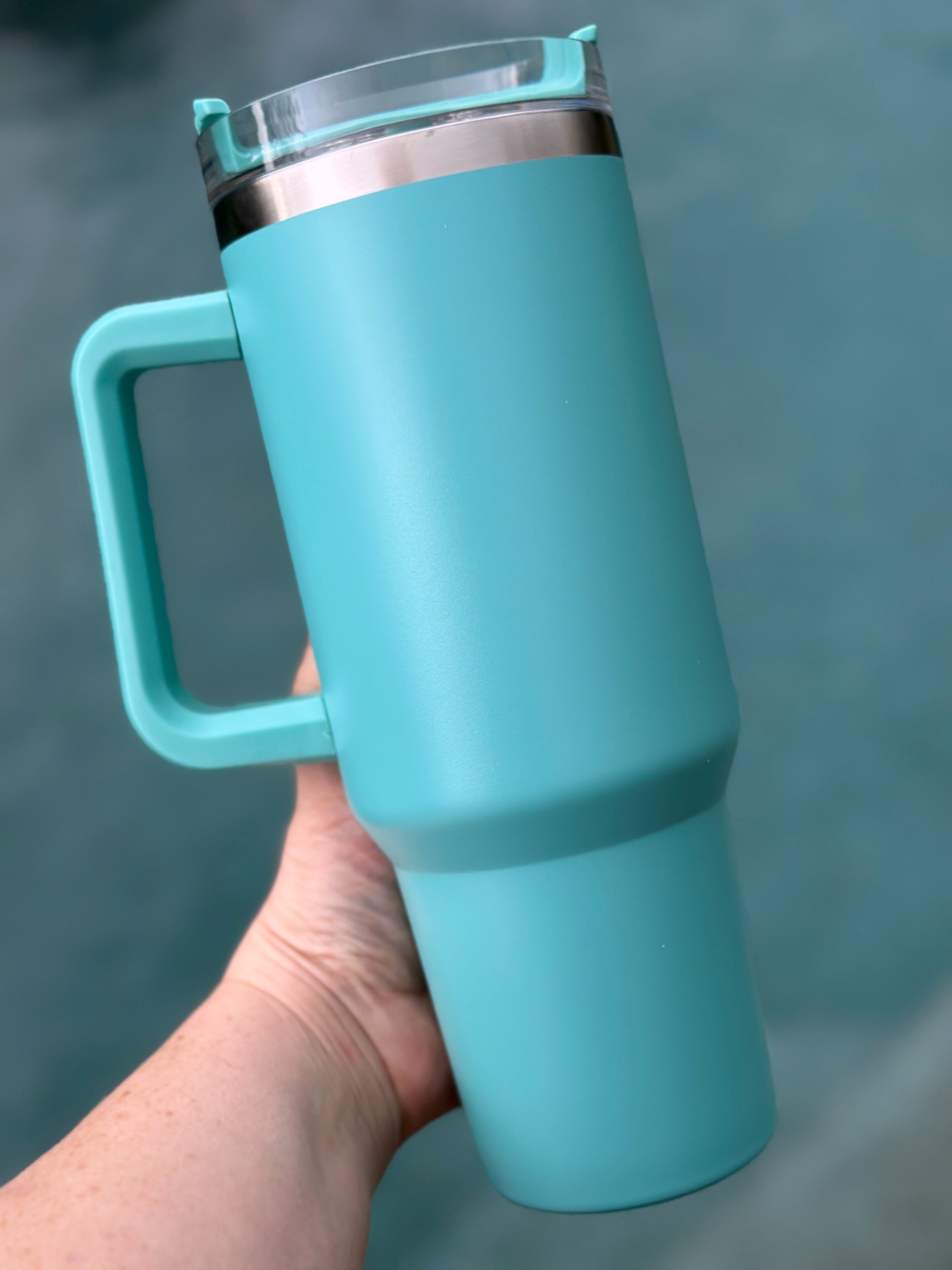 40 oz double walled insulated tumbler in various colors with a screw top lid and straw, perfect for customization.