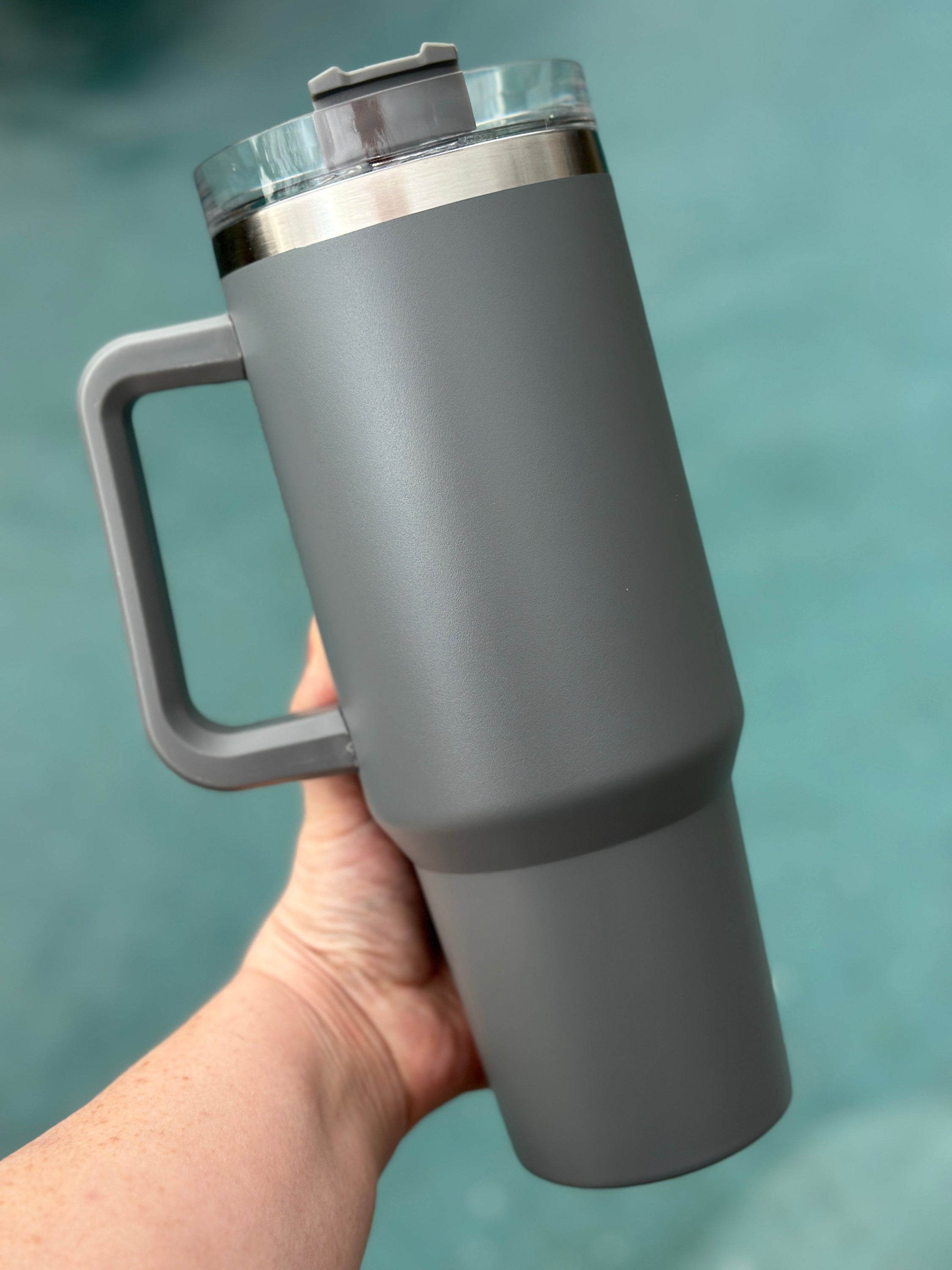 40 oz double walled insulated tumbler in various colors with a screw top lid and straw, perfect for customization.