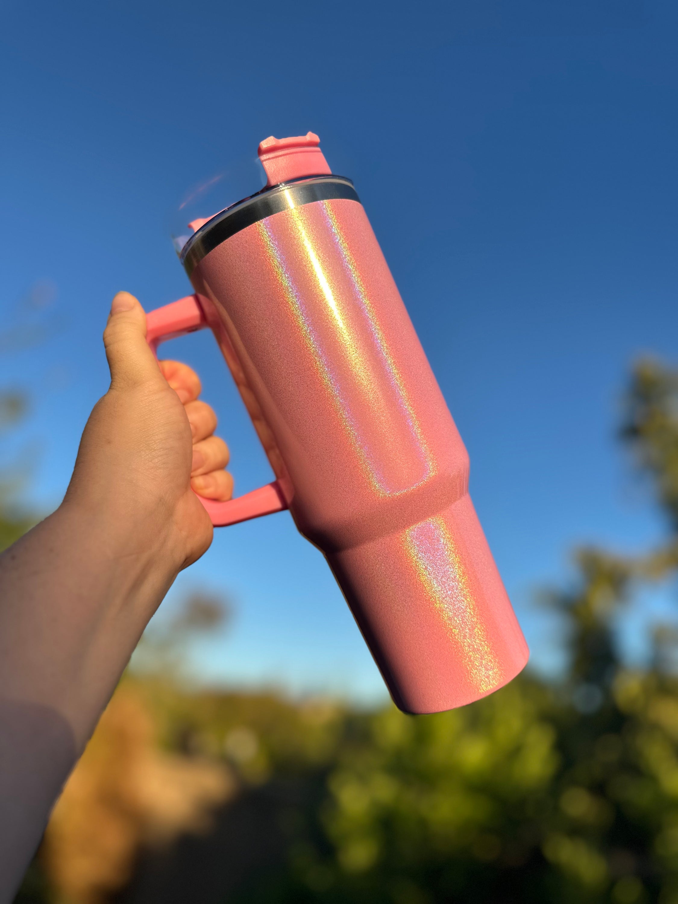 40 oz Holographic Glitter Sublimation Double Walled Tumbler with screw top and straw, showcasing a vibrant glitter finish.