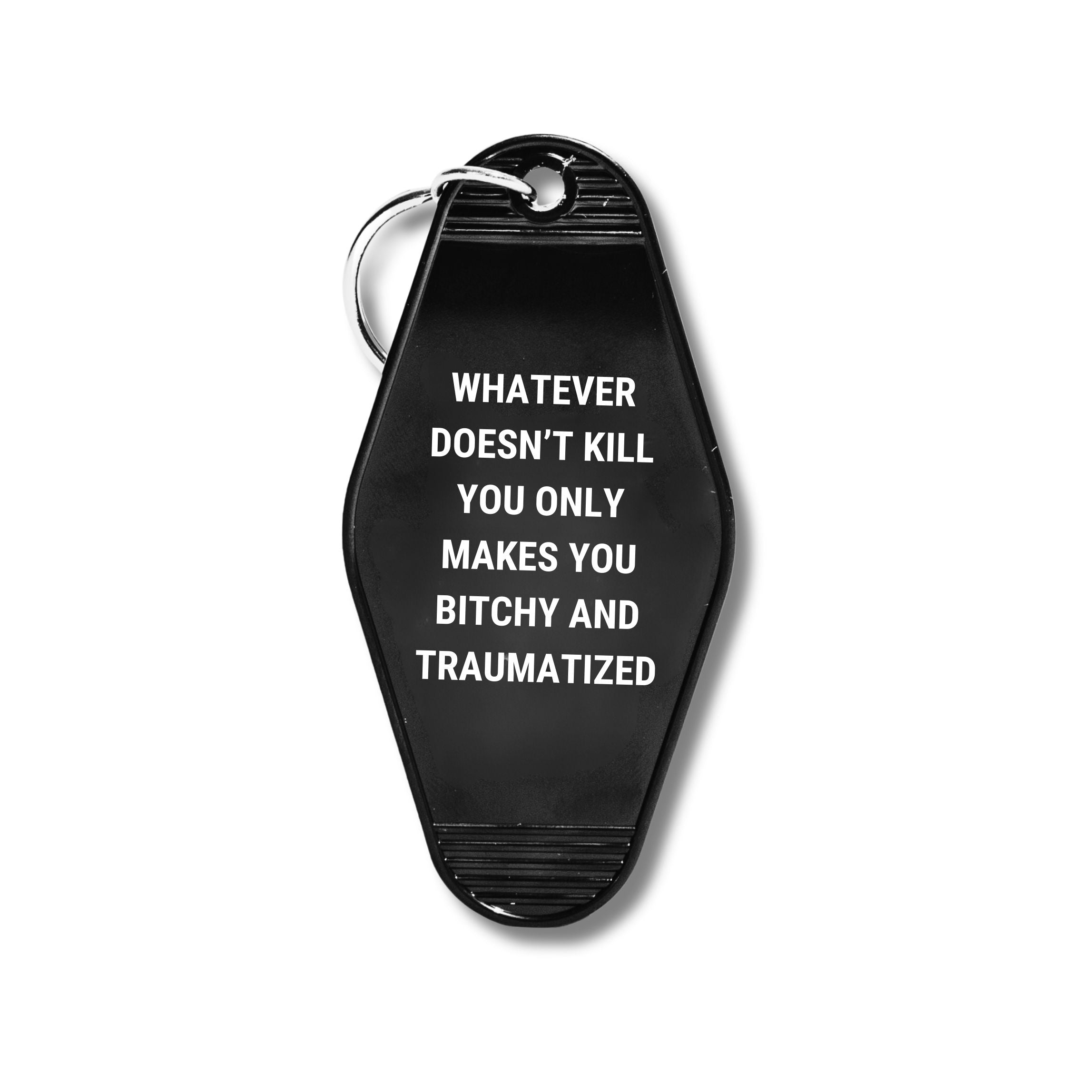 A humorous motel keychain featuring the phrase 'Whatever Doesn’t Kill You Only Makes You Bitchy And Traumatized' with a split ring attachment.