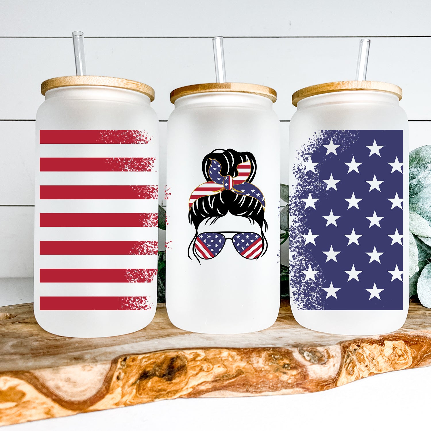 American Messy Bun Glass Can Tumbler with bamboo lid and clear straw, featuring a frosted glass design.