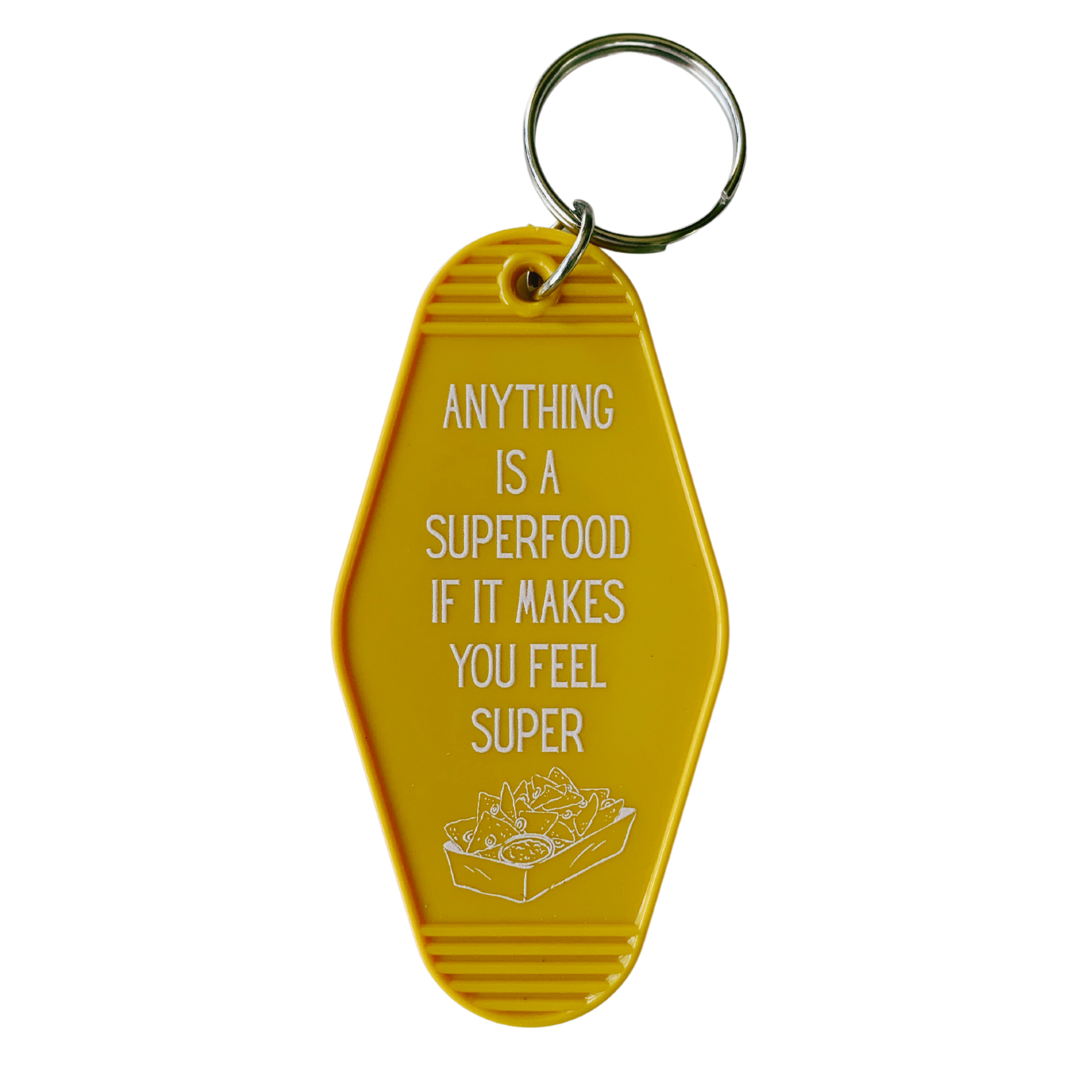 Colorful motel-style keychain with nacho design and text 'ANYTHING IS A SUPERFOOD IF IT MAKES YOU FEEL SUPER'.