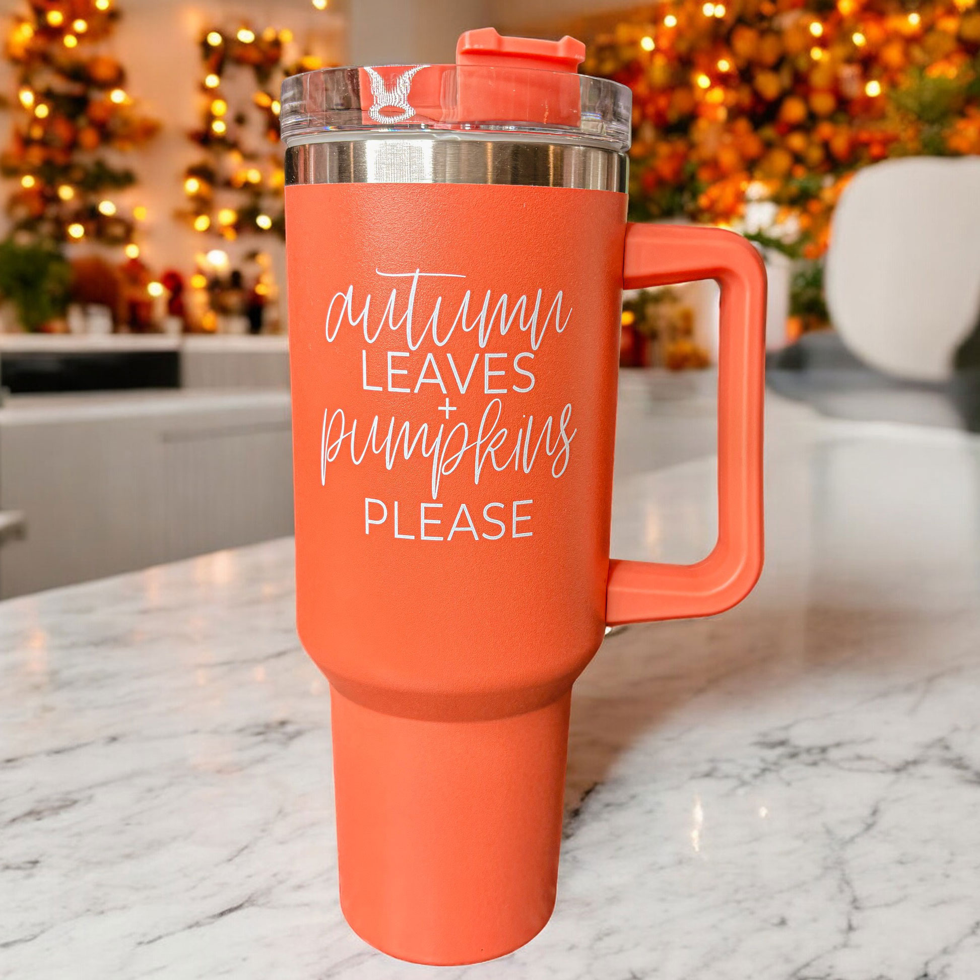 Orange 40oz tumbler with 'Autumn Leaves + Pumpkins Please' design, featuring a matte finish and a 3-in-1 lid.