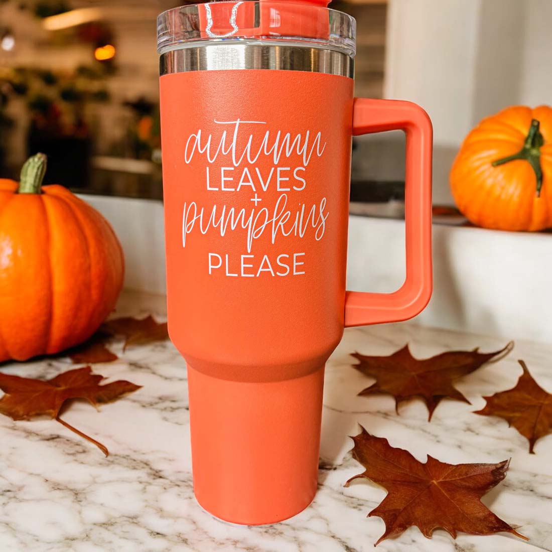 Orange 40oz tumbler with 'Autumn Leaves + Pumpkins Please' design, featuring a matte finish and a 3-in-1 lid.