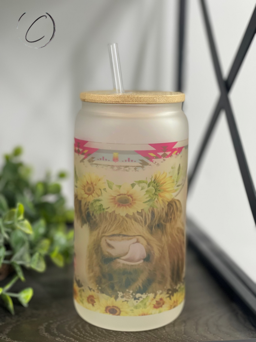 Aztec Sunflower Highland Cow 16oz Libbey Glass with a vibrant sunflower design and reusable straw.