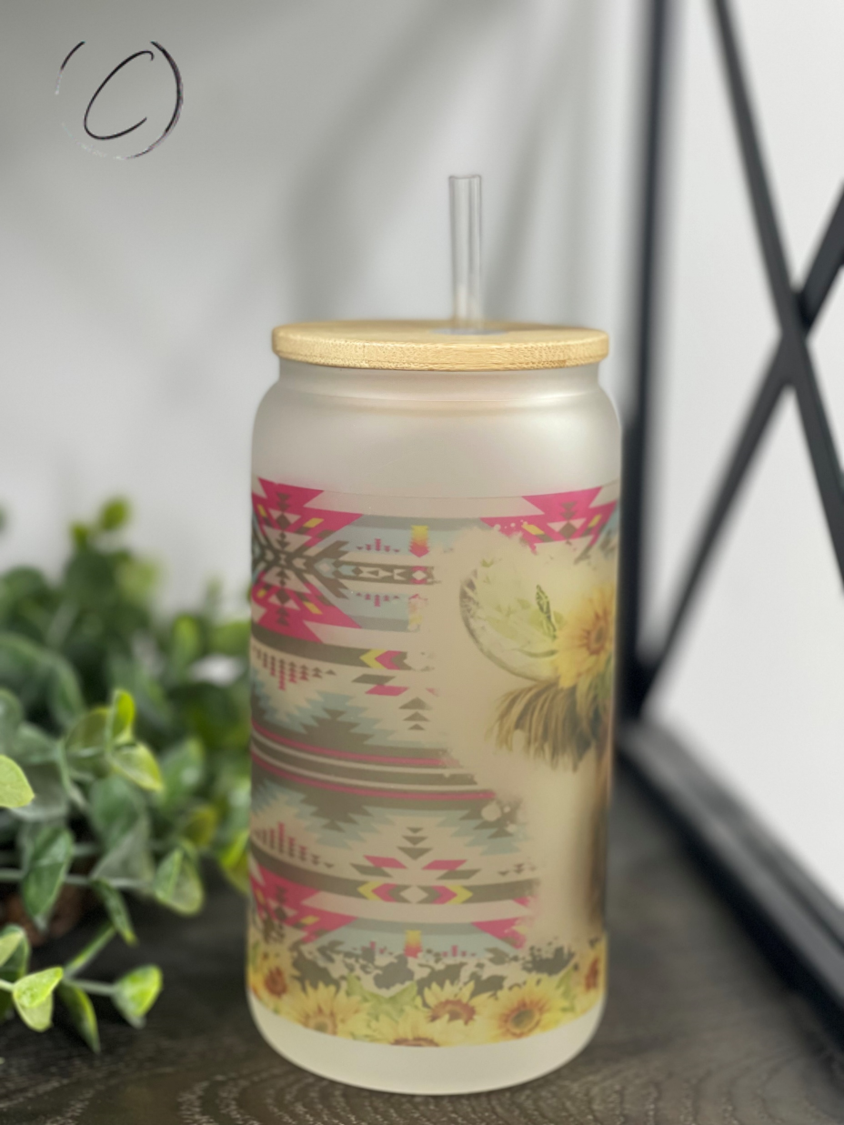 Aztec Sunflower Highland Cow 16oz Libbey Glass with a vibrant sunflower design and reusable straw.