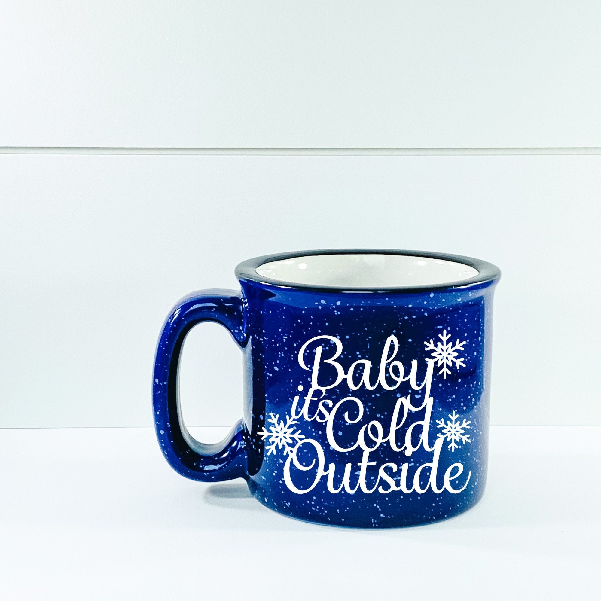Ceramic Baby It's Cold Outside Campfire Mug with outdoor vinyl design, perfect for cozy beverages.