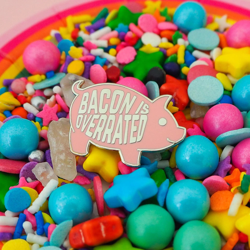 Bacon Is Overrated Enamel Pin featuring a cute pink pig design, made of hard enamel with silver plating.