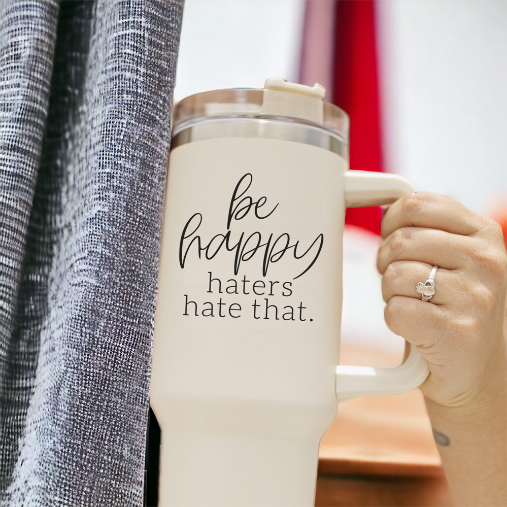 Be Happy 40oz insulated mug with handle, lid, and straw, featuring a matte cream finish and black graphic design.