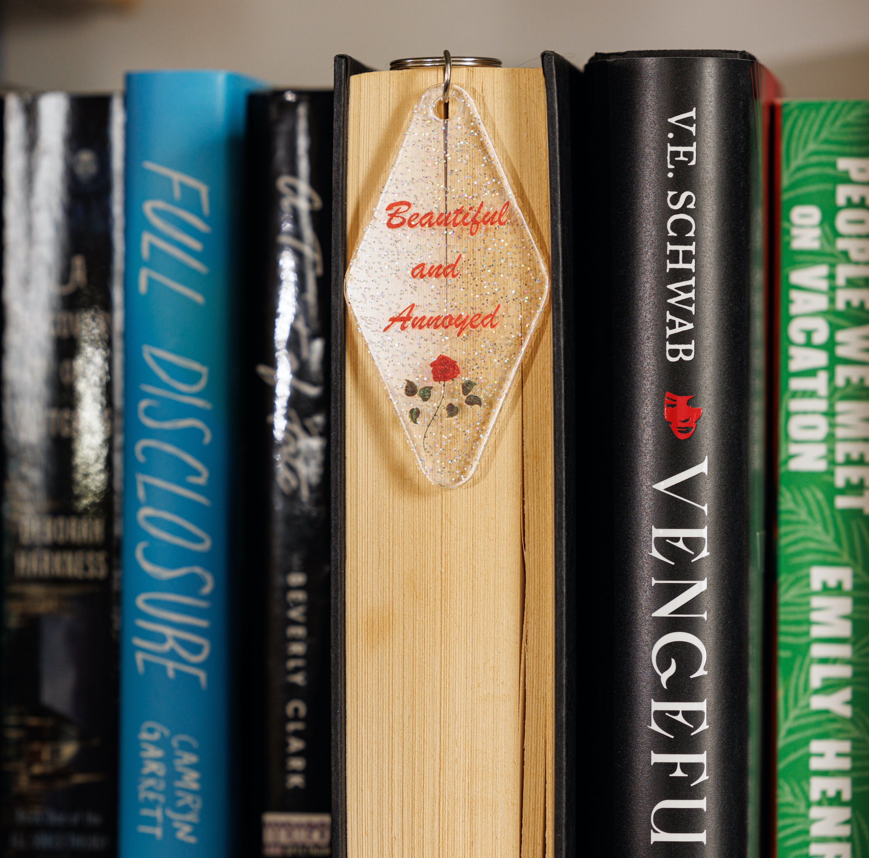 Beautiful and Annoyed Motel Style Key Tag Keychain with clear glitter design, featuring the phrase 'Beautiful and Annoyed' in bold letters.