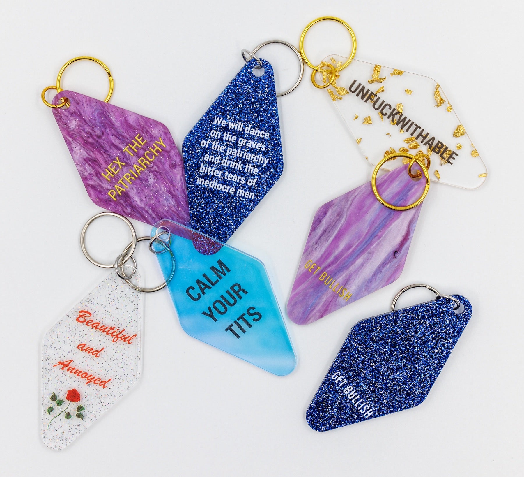 Beautiful and Annoyed Motel Style Key Tag Keychain with clear glitter design, featuring the phrase 'Beautiful and Annoyed' in bold letters.