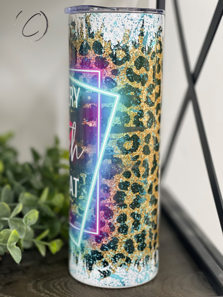 Behind Every Bad B**** 20oz Skinny Tumbler with a stylish design and reusable straw, perfect for hot and cold beverages.