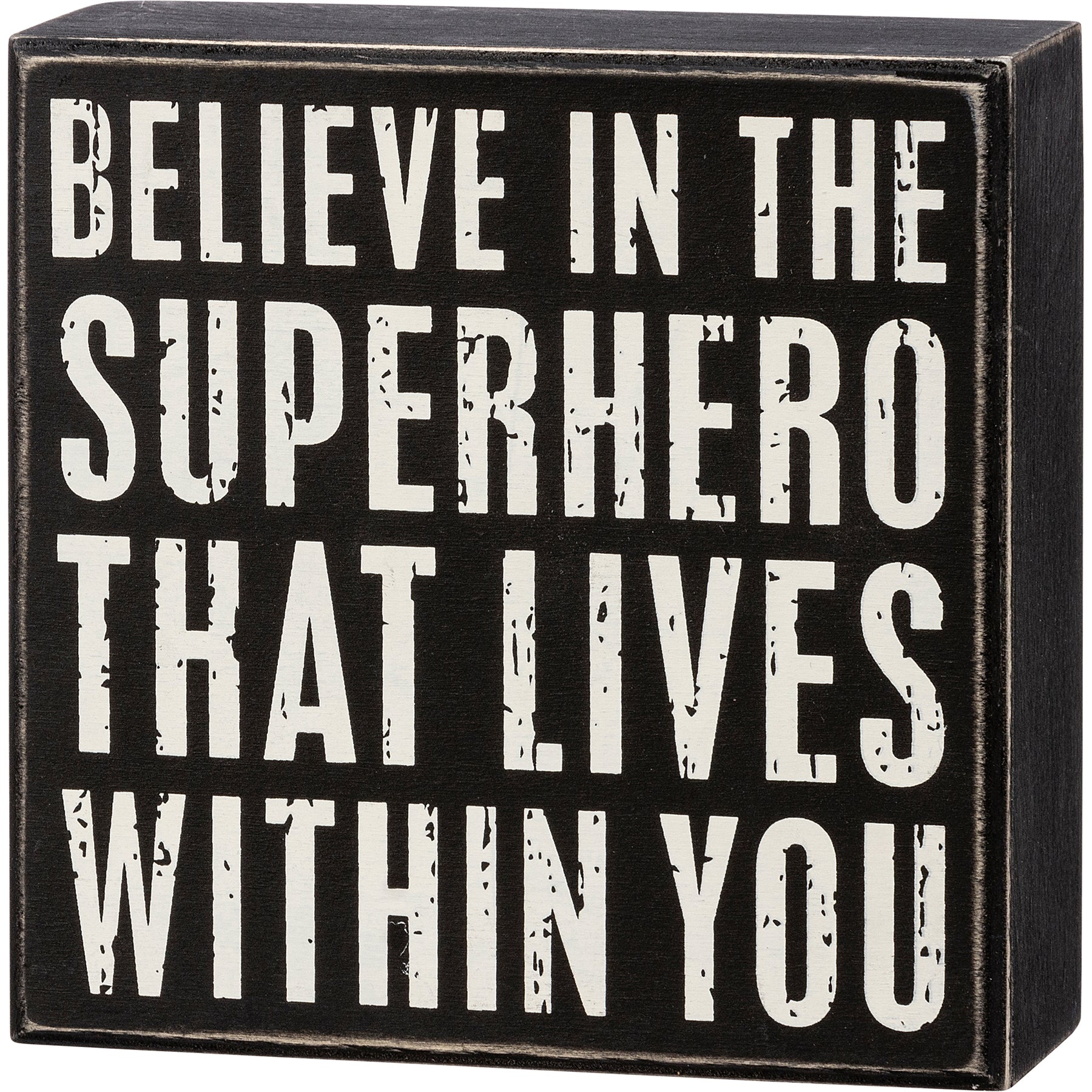 A black and white wooden box sign with the phrase 'Believe In The Superhero That Lives Within You' in a distressed finish, perfect for home decor.