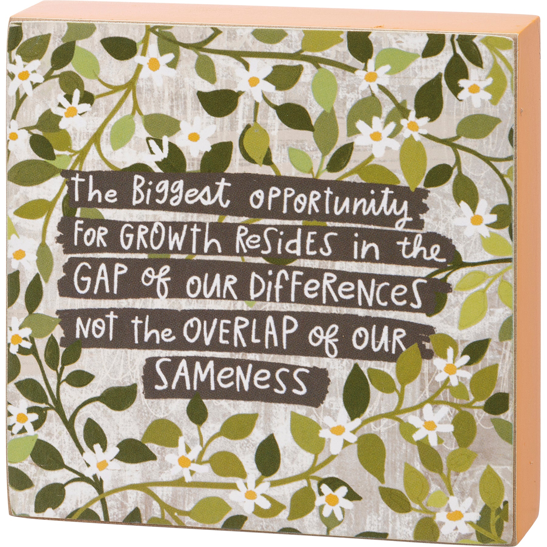 A colorful wooden block sign with an inspirational quote about growth and diversity, measuring 4 inches by 4 inches.