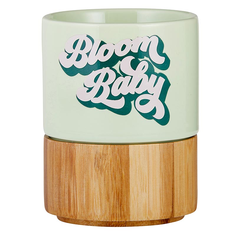 Bloom Baby Petite Ceramic Mug in light green with bamboo base, perfect for tea or snacks.