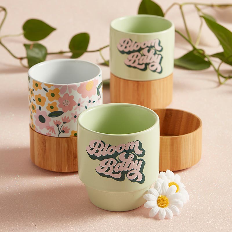 Bloom Baby Petite Ceramic Mug in light green with bamboo base, perfect for tea or snacks.