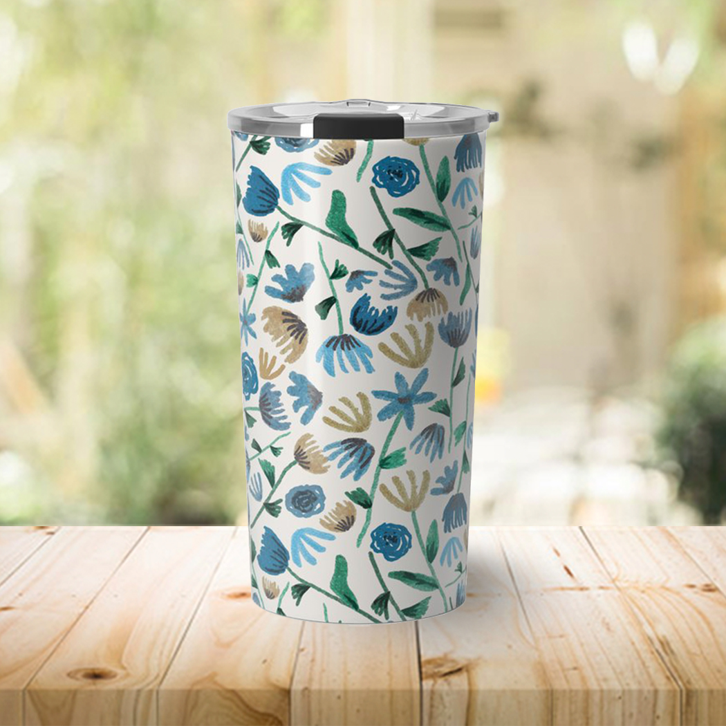 Blue Ink Floral Travel Coffee Mug featuring a vibrant floral design on a stainless steel body, perfect for hot and cold beverages.