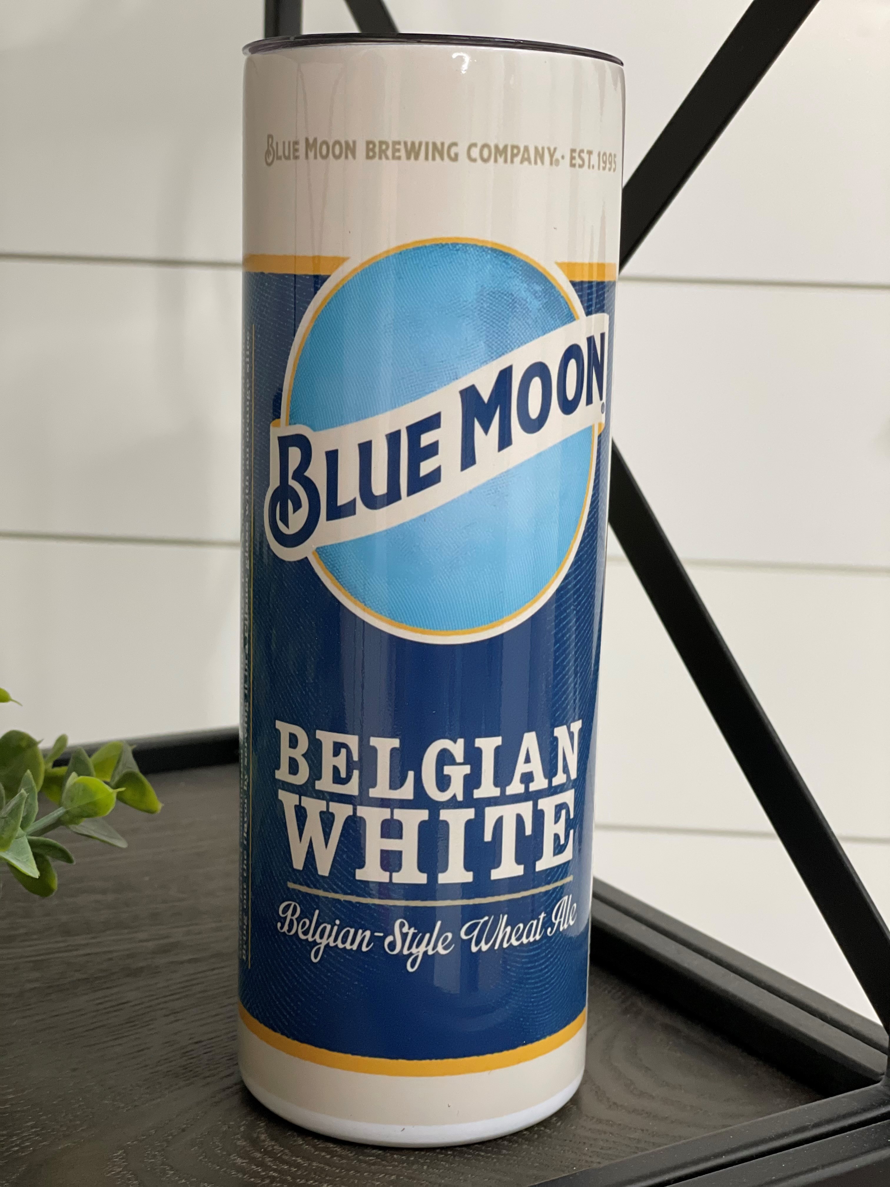 Blue Moon 20oz Skinny Tumbler with a vibrant design, featuring a reusable straw and a sleek, insulated body.