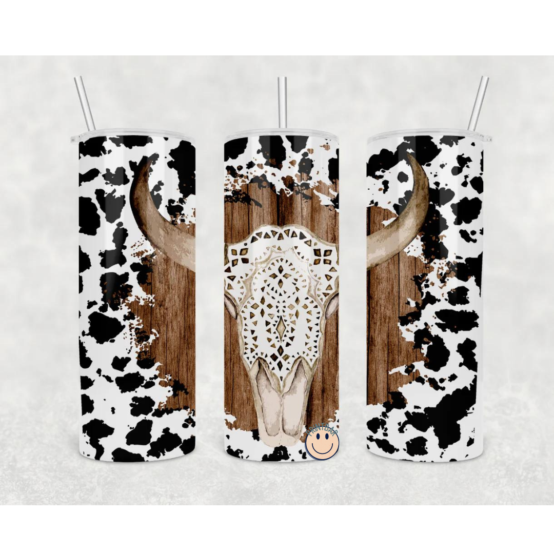 Boho Cow Print 20oz Skinny Tumbler with stainless steel body and clear lid, featuring a stylish cow print design.