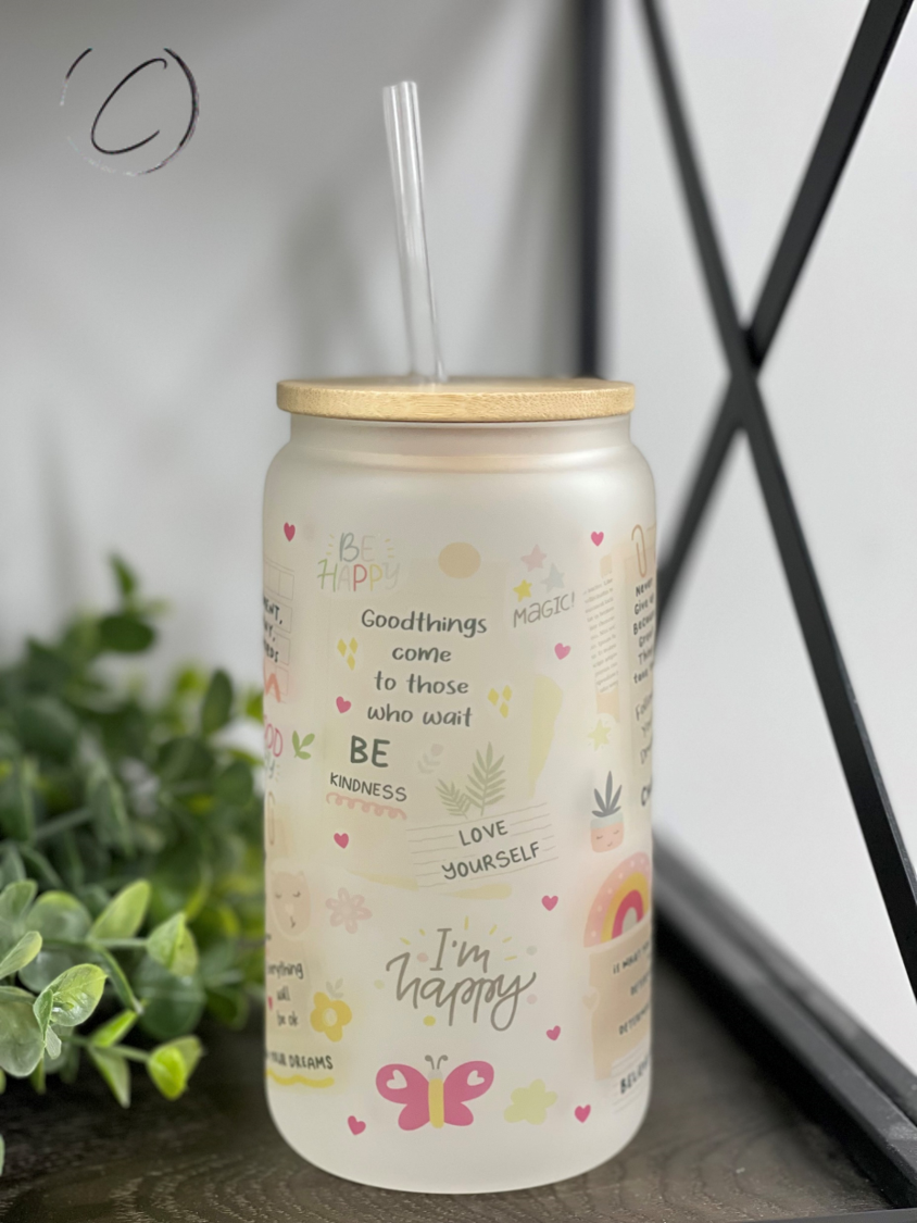 A stylish 16oz Libbey glass tumbler featuring boho daily affirmations, complete with a reusable straw, showcasing its unique design.