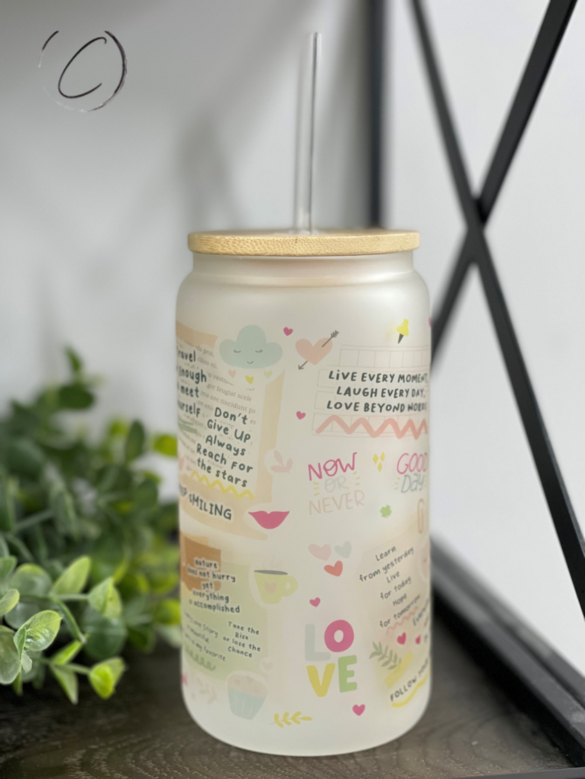 A stylish 16oz Libbey glass tumbler featuring boho daily affirmations, complete with a reusable straw, showcasing its unique design.