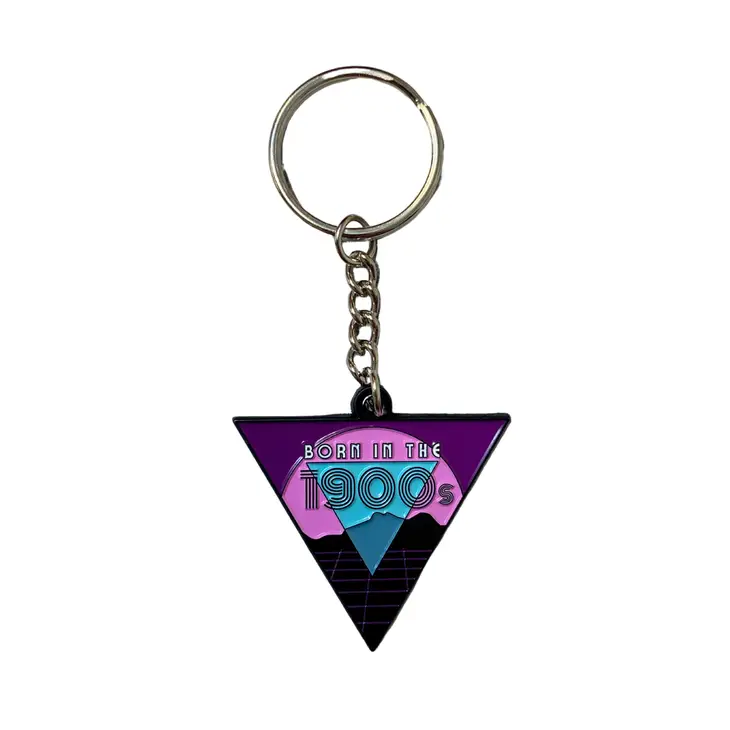 Born in the 1900s enamel keychain featuring vibrant colors and retro design, attached to a split ring.