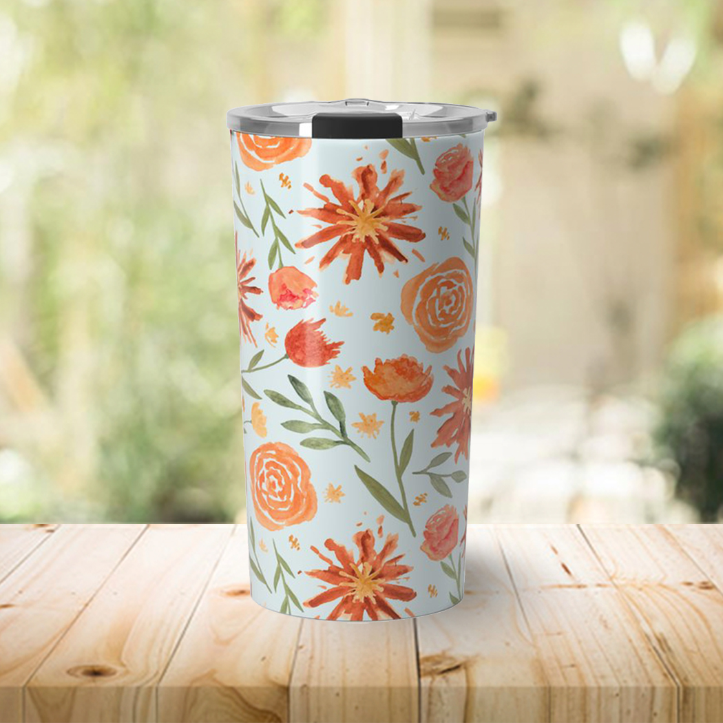 Burnt Orange Flower Burst Travel Coffee Mug with vibrant floral design, showcasing its stainless steel body and double-wall insulation.