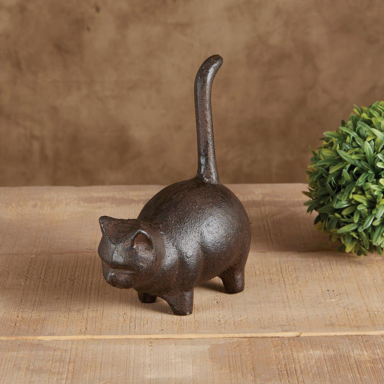 A charming brown cast iron round cat figurine, perfect for home decor, showcasing a whimsical design that appeals to cat lovers.