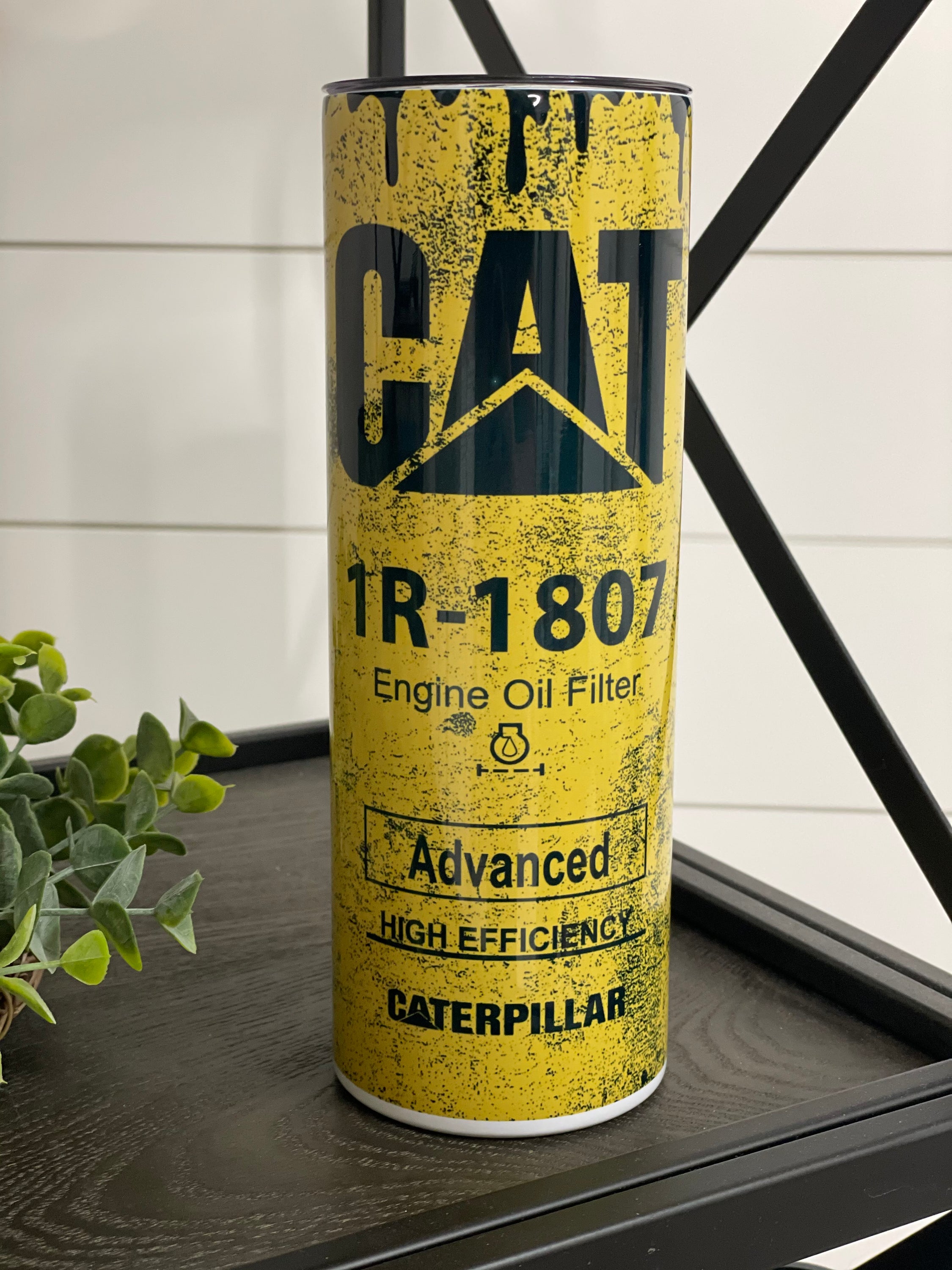 CAT Filter 20oz Skinny Tumbler with vibrant full wrap design and reusable straw.