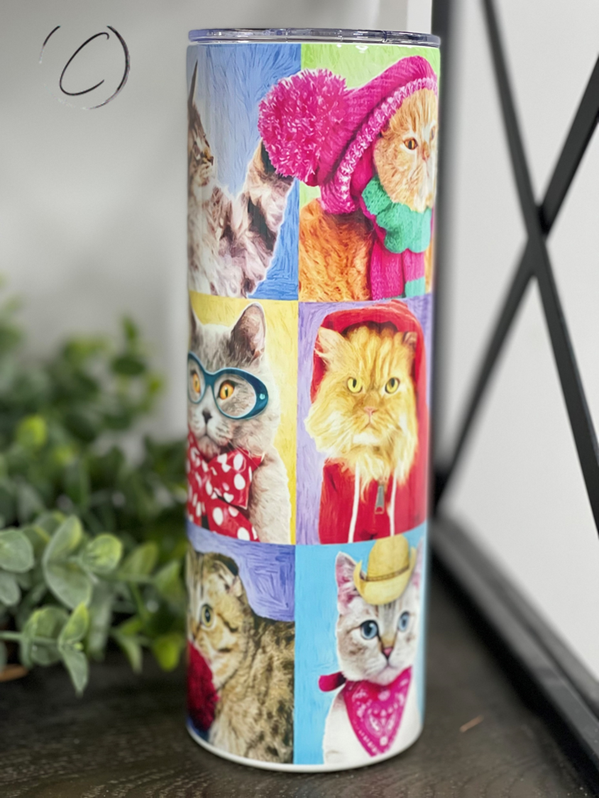 A stylish 20oz skinny tumbler featuring vibrant cat portraits, designed for durability and ease of use, complete with a reusable straw.