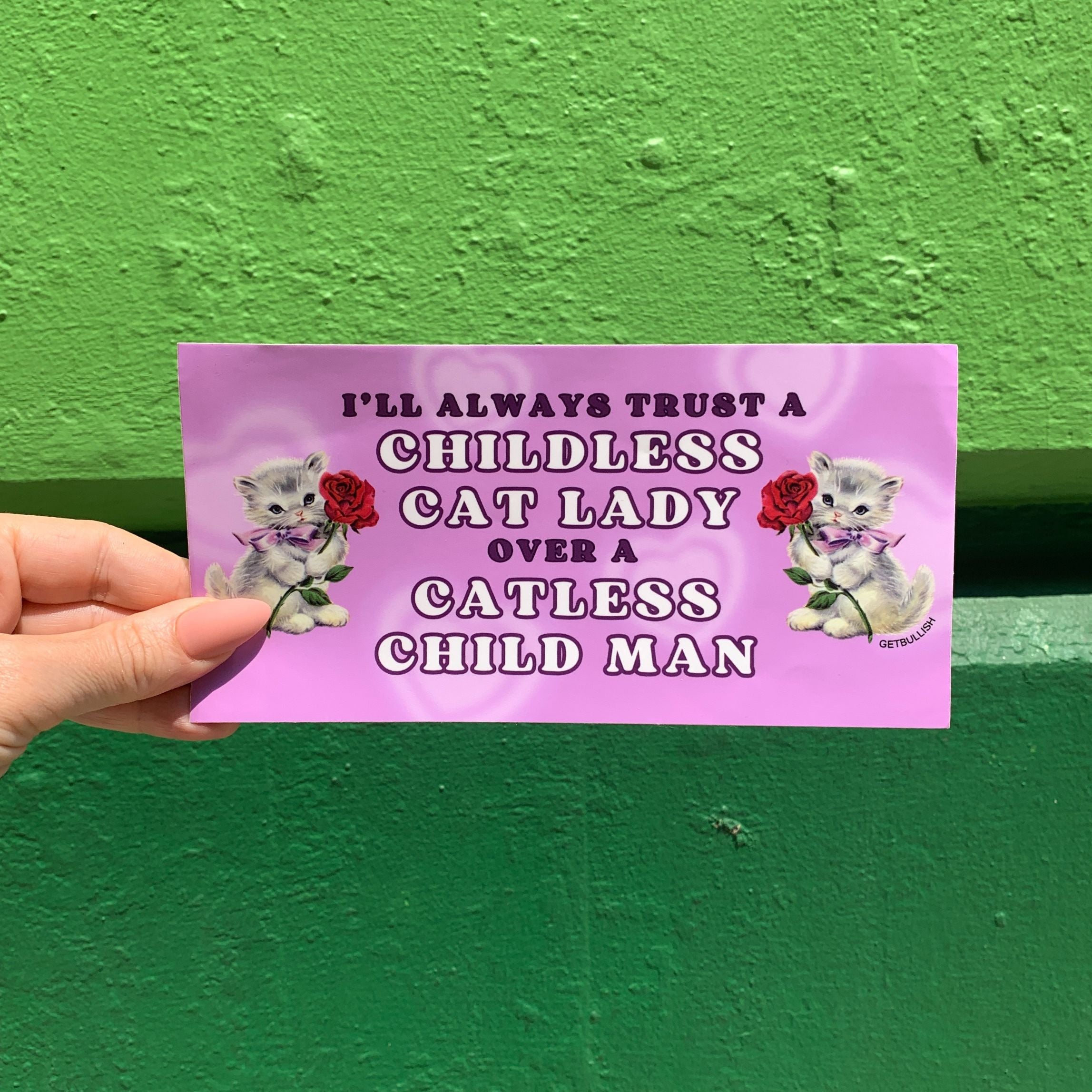 A humorous bumper sticker featuring the phrase 'I’ll Always Trust a Childless Cat Lady Over a Catless Child Man', perfect for cat lovers.