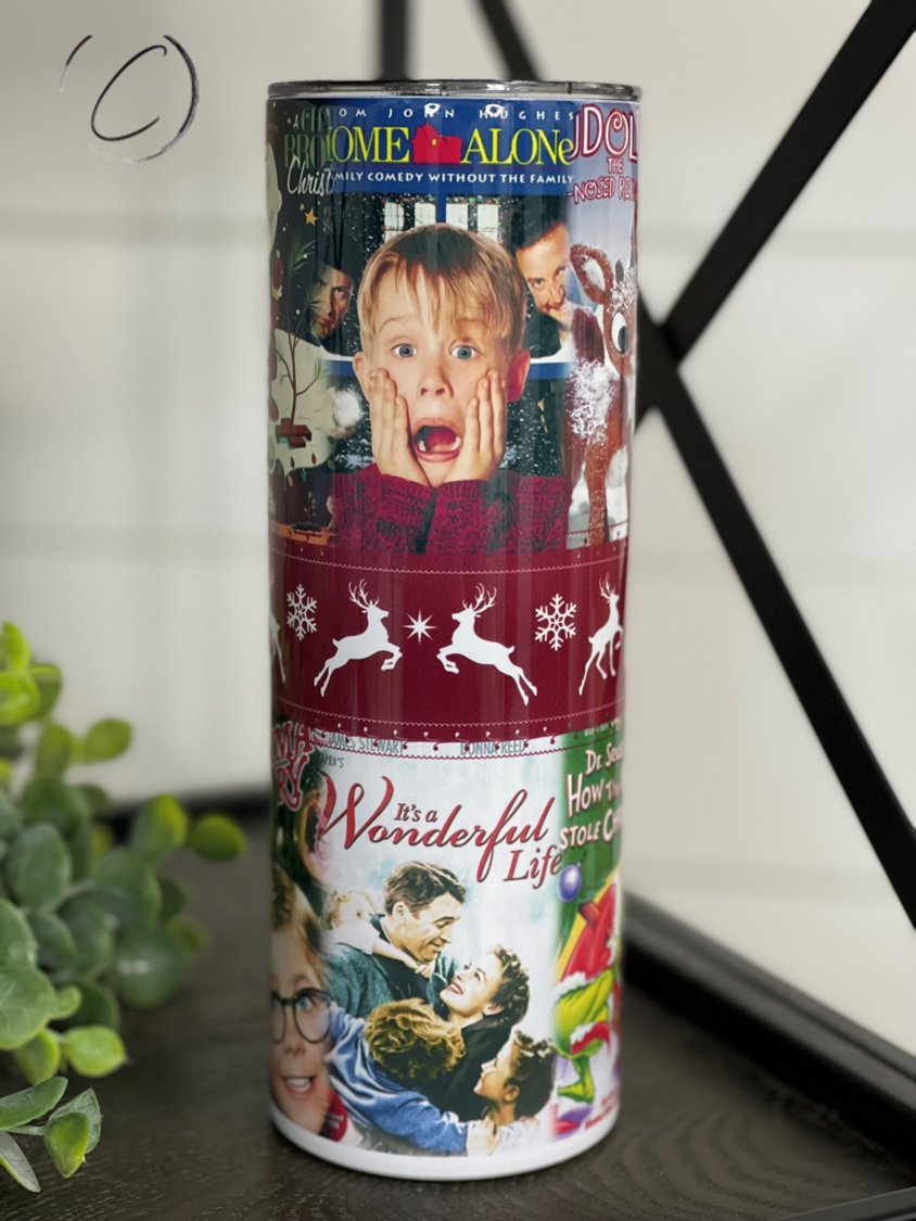 Classic Christmas Movie Posters 20oz Skinny Tumbler featuring vibrant designs of iconic holiday films, complete with a reusable straw.