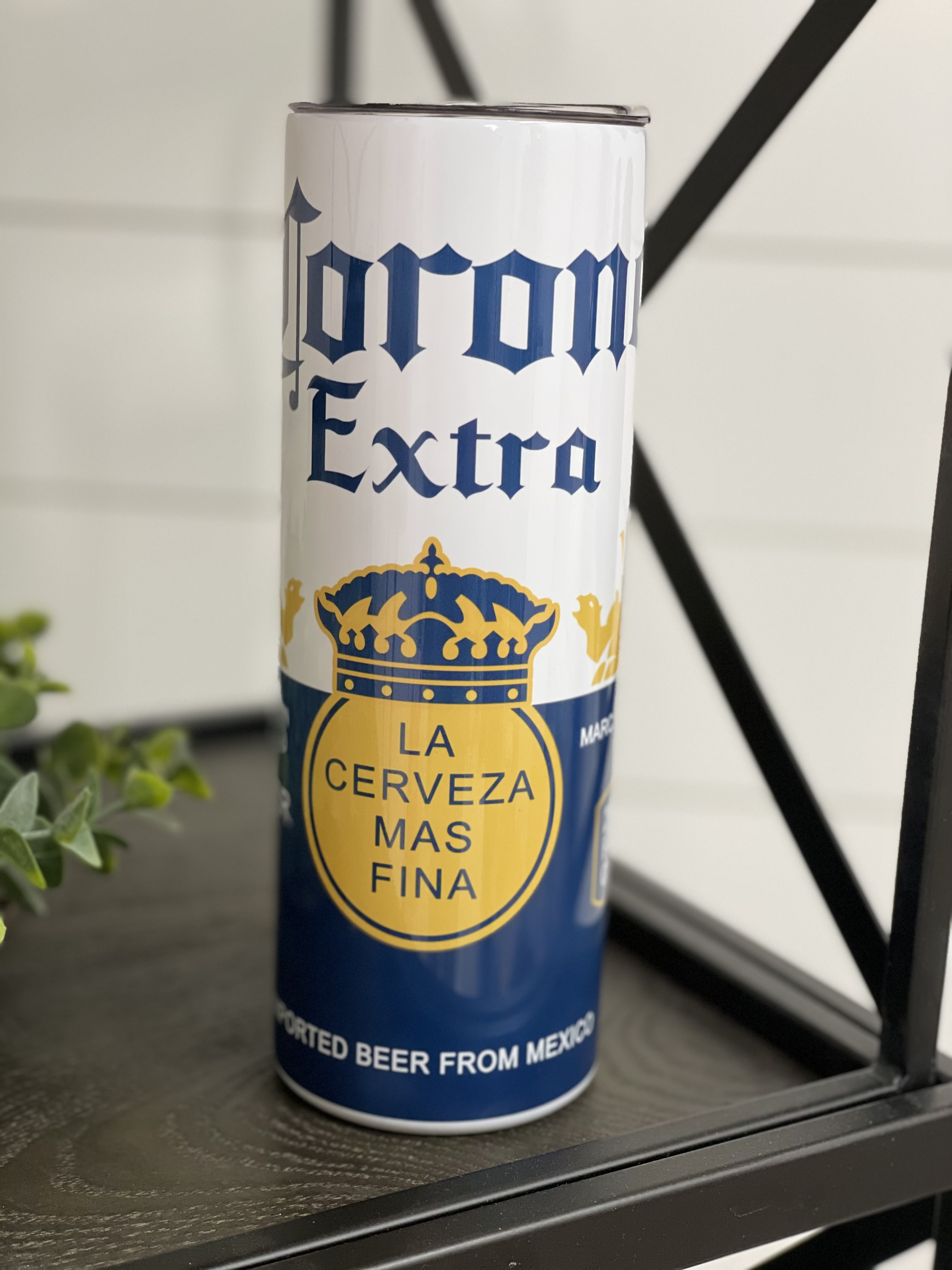 Corona Extra 20oz Skinny Tumbler featuring a full wrap design with the iconic Corona logo, perfect for hot and cold beverages.