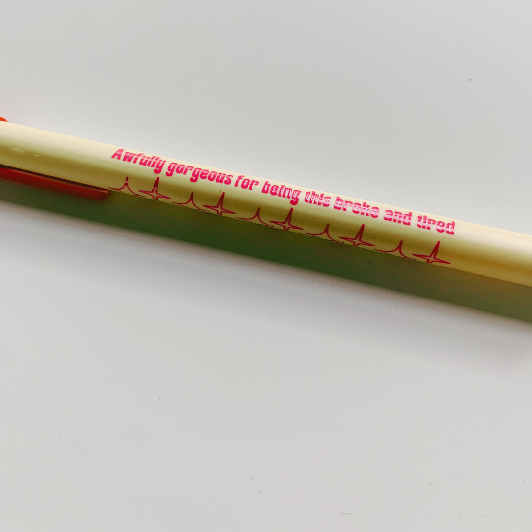 A stylish violet ballpoint pen with a fine point and blue ink, embodying a modern Gen Z aesthetic.