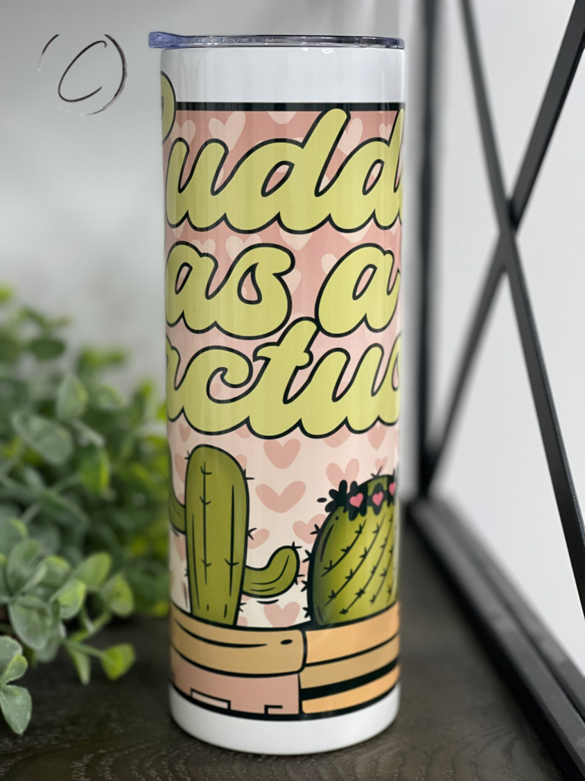 Cuddly As A Cactus 20oz Skinny Tumbler featuring a vibrant cactus design, reusable straw, and insulated body.