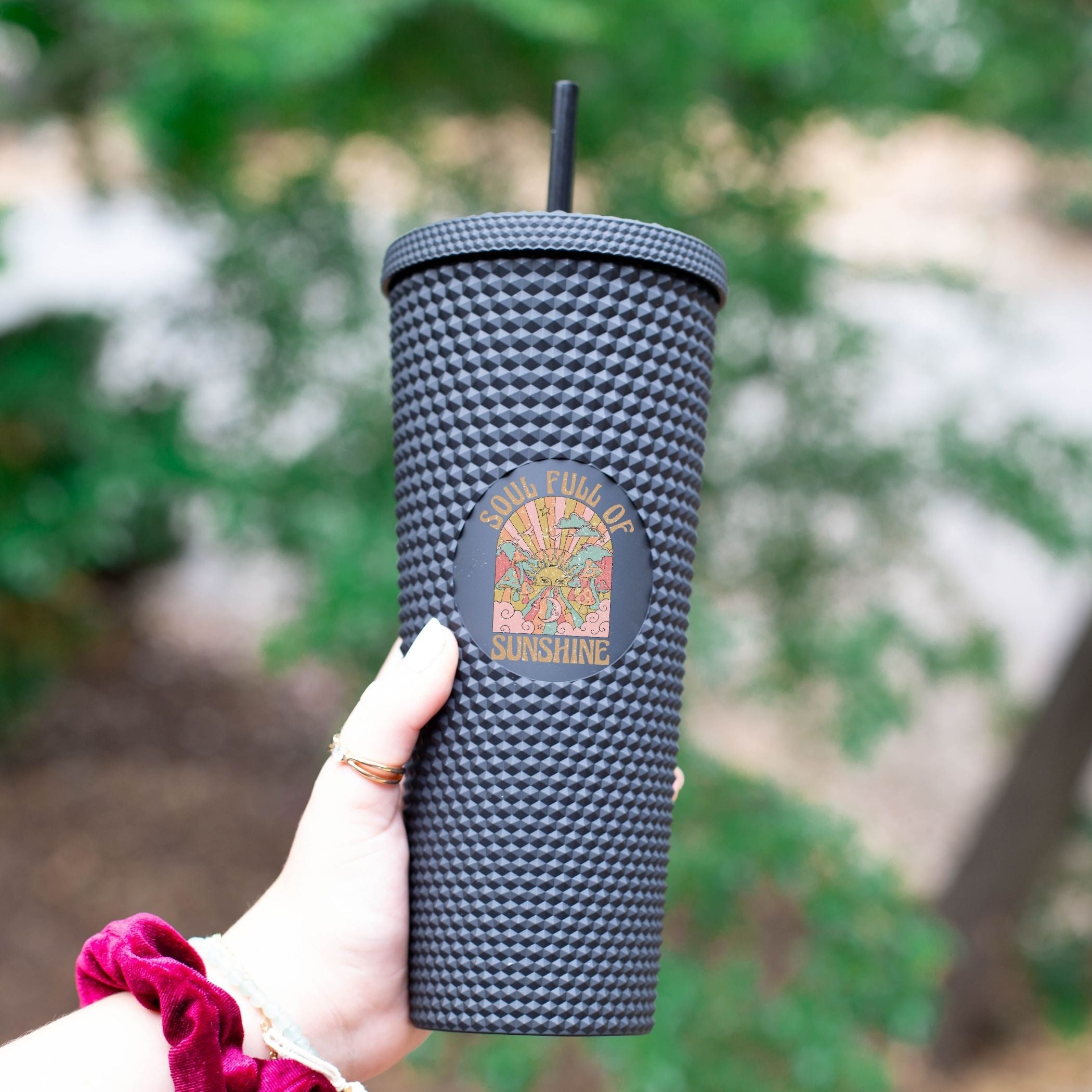 Custom studded 24oz double walled tumbler featuring a beach-themed design with seashells and waves, perfect for summer drinks.