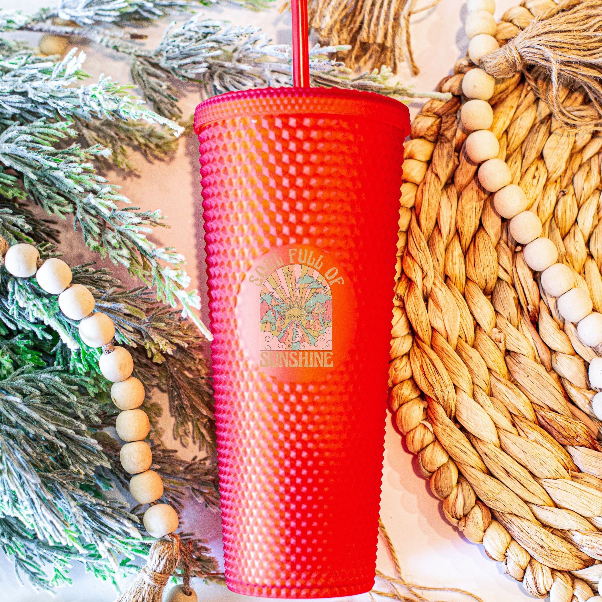 Custom studded 24oz double walled tumbler featuring a beach-themed design with seashells and waves, perfect for summer drinks.