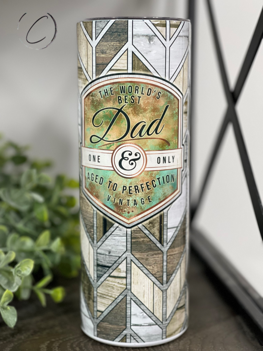 A stylish 20oz skinny tumbler with 'Dad, Aged To Perfection' design, featuring a reusable straw and high-quality construction.