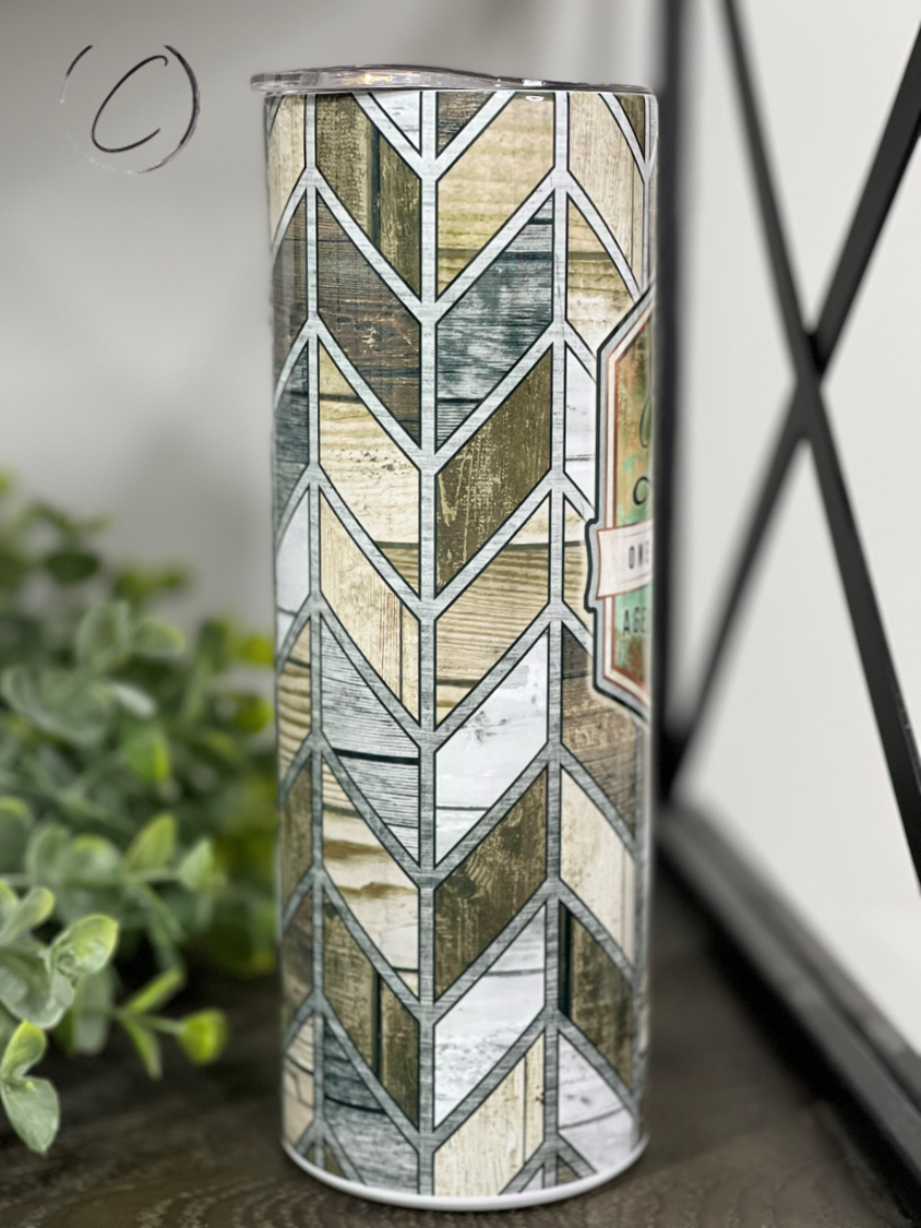 A stylish 20oz skinny tumbler with 'Dad, Aged To Perfection' design, featuring a reusable straw and high-quality construction.