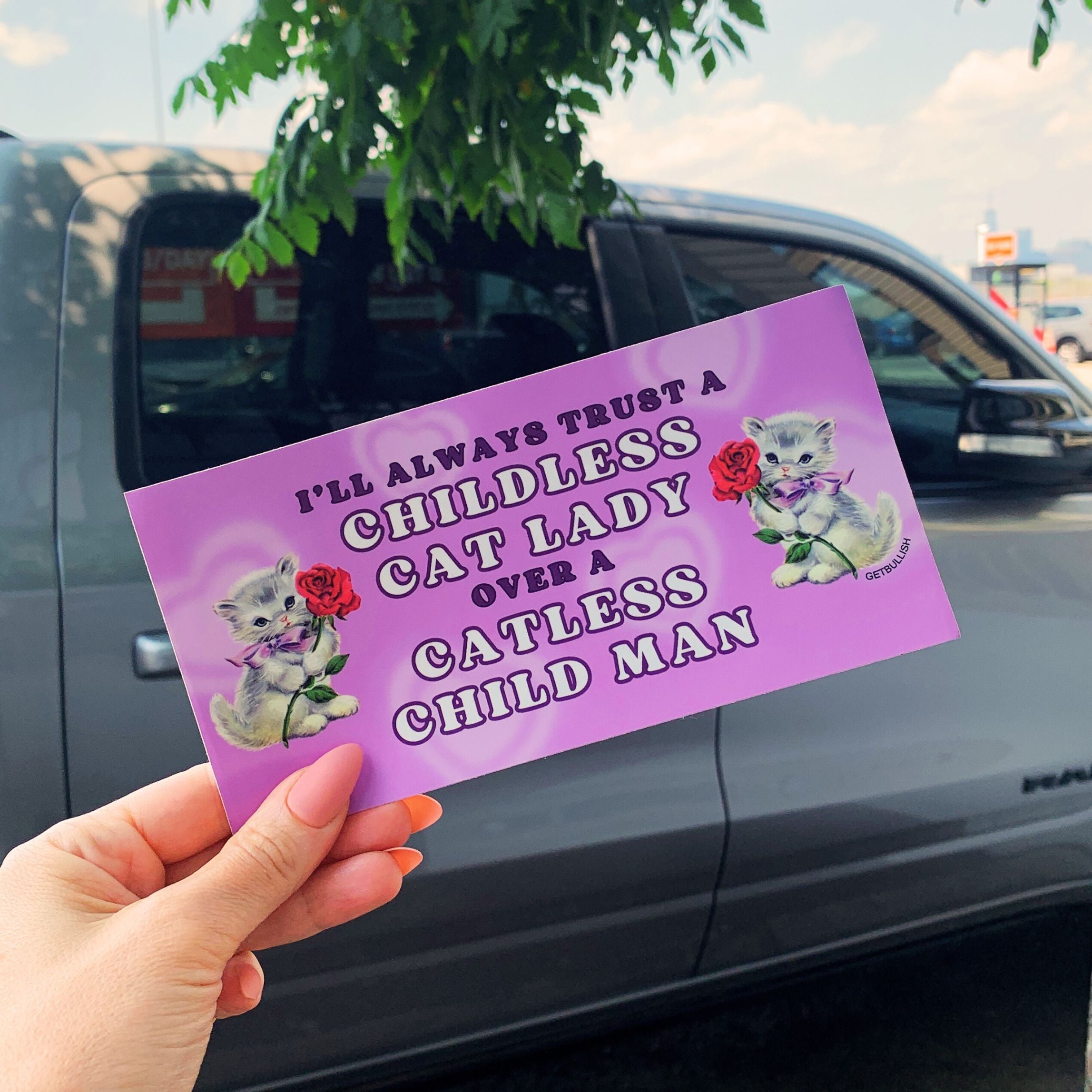 A colorful bumper sticker reading 'I’ll Always Trust a Childless Cat Lady Over a Catless Child Man' with a glossy finish, perfect for cat lovers.